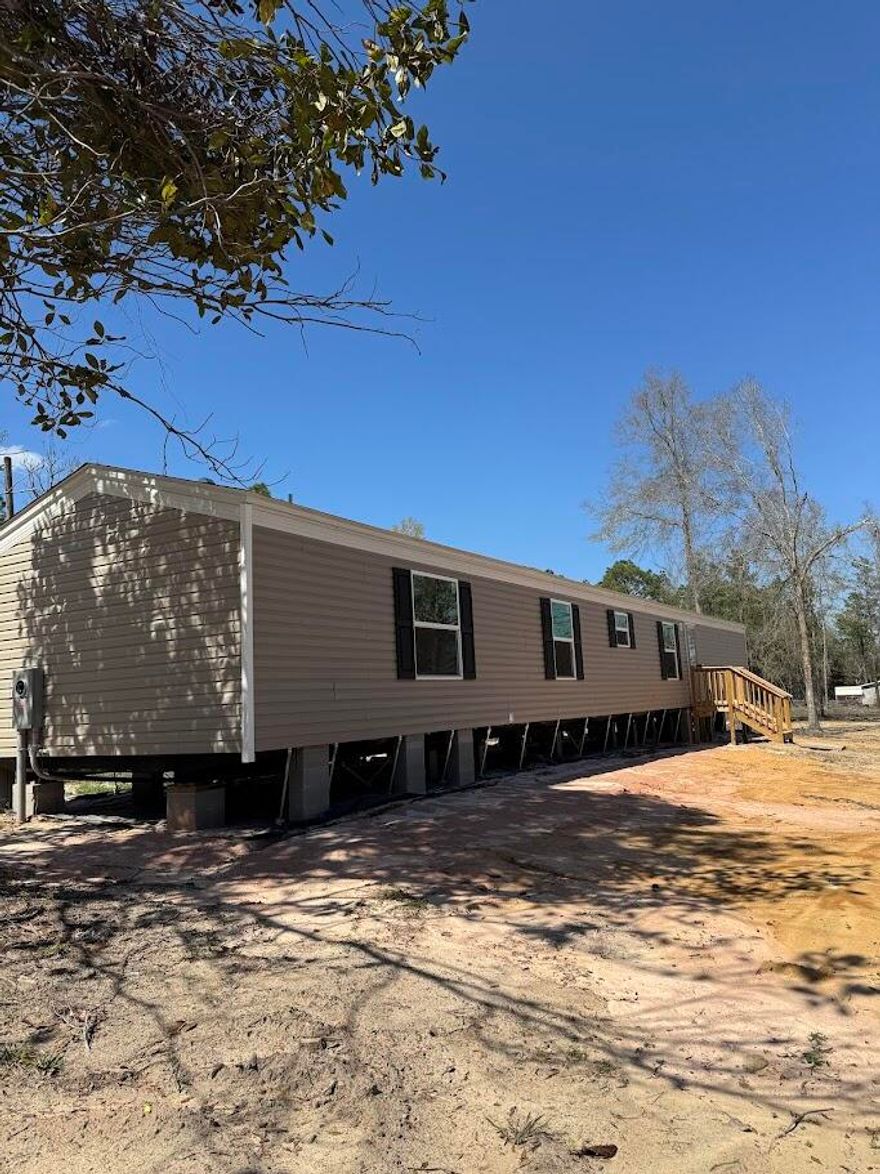 Brand new 4 bedroom 2 bath mobile home on 1.25 acres. This lot is located in an X flood zone and there is no HOA. Quiet area with a huge lot. Plenty of room for a garden, outbuildings and 4 wheelers. Spacious floor plan with 3 bedrooms and bonus room that can be used for an office or another bedroom as needed.