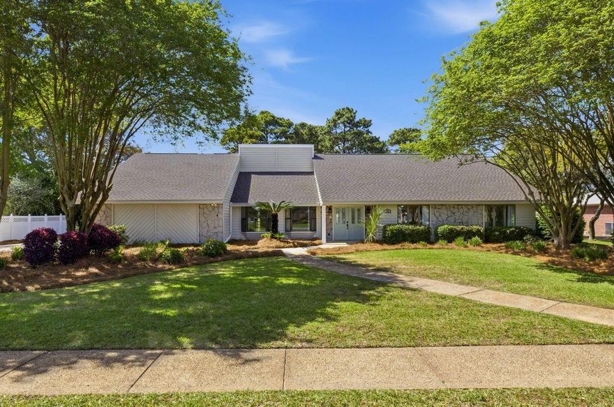 Set along the fairways of the Indian Bayou Golf Course on a half acre lot, this 4 bedroom home offers generous living spaces, abundant natural light, and peaceful golf course views in one of Destin's most established and desirable neighborhoods. Recent improvements include fresh interior paint, new insulation, a new roof installed in March 2026, and HVAC replaced in 2022, providing both comfort and peace of mind.

Inside, the home welcomes you with a spacious living room featuring vaulted ceilings that give the space an open, airy feel, anchored by a floor to ceiling fireplace that serves as a warm and inviting centerpiece for everyday living. A formal dining room or flex space offers options for hosting dinners, playroom for the kids, or a home office. The large kitchen is designed for both function and gathering, complete with granite countertops, stainless steel appliances, and ample cabinet and counter space. Just beyond, the Florida room with a built-in bar creates the perfect spot for entertaining or relaxing while enjoying the backyard views.

Along the back of the home, a wall of windows fills the main living areas with natural light and showcases the serene golf course setting, bringing the outdoors in and creating a bright, welcoming atmosphere throughout the day.

With its spacious layout, large lot, and scenic golf course backdrop, this home offers comfortable living in the heart of Destin, just minutes from the area's white sand beaches, dining, and shopping.