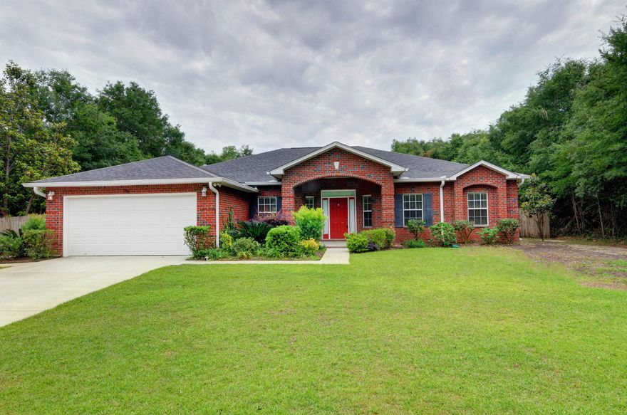 Beautifully maintained 4 bedroom, 2 bath home features a split bedroom open floor plan with a formal living and dining room. The charming kitchen is perfect for entertaining with an eat-in breakfast nook that opens to the family room. Master bedroom has it's own private access to the backyard via sliding glass doors! The master on suite includes double vanities, separate shower, a large walk-in closet, and a large soaking tub. The backyard is completely fenced in with a covered patio, lots of lawn space and storage building. Extra parking for your boat or RV. Located close to A rated schools, white sand beaches, and shopping. Don't miss this opportunity to own in desirable Mossy Oaks!