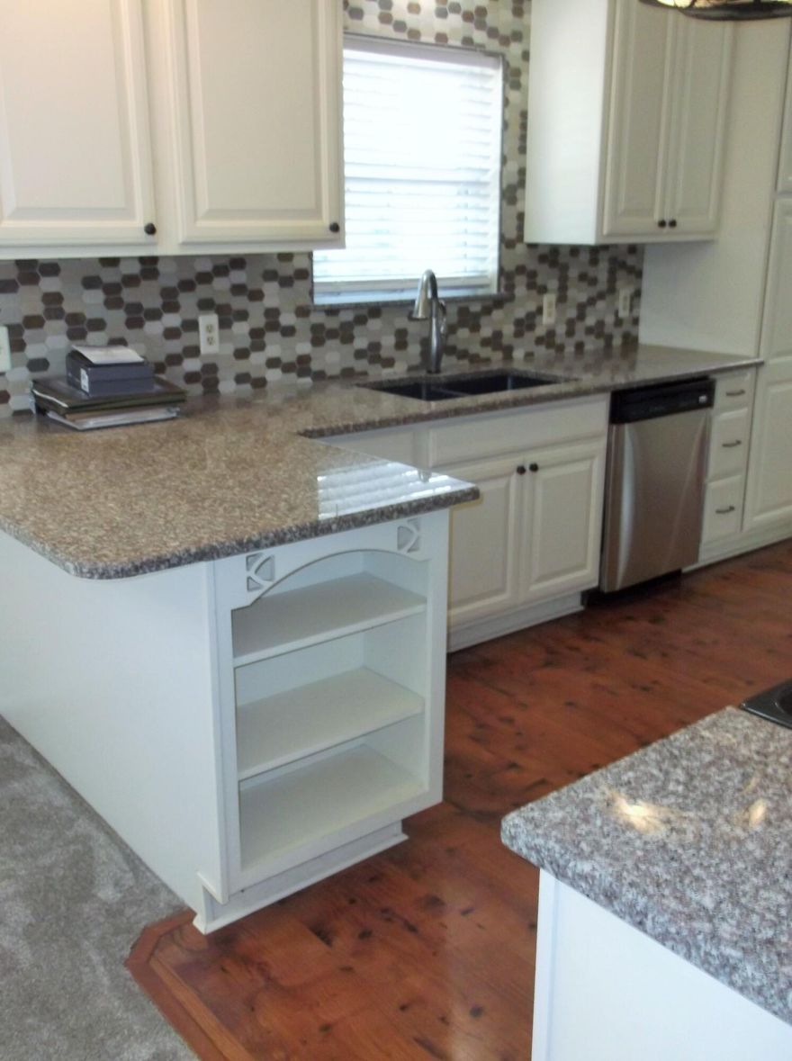 This well-maintained home offers a comfortable layout with both a living room & a separate den, giving you extra space for everyday living or entertaining. The kitchen has been updated with granite countertops, soft-close cabinets, tile backsplash, & a built-in microwave, making it a functional & inviting space. The interior has also been recently painted, and new carpet has been installed throughout. Several major updates have already been completed, including a new AC unit in 2022, water heater in 2025, & a whole-house generator. The metal roof was replaced in 2013, and the windows were updated in 2010 & come with a transferable lifetime warranty. The home also features copper wiring. Outside, there are 2 yard buildings that provide additional storage space and will convey as-is.