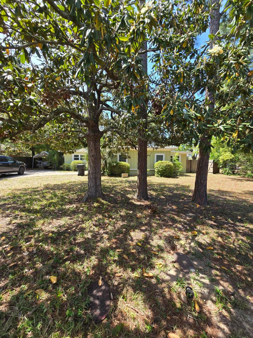 This Elliot Point HOME is CONVENIENTLY located between Military Bases, Shopping and Schools, and of course close to the BEACH!  This home features  4 Bedrooms, Large Dinning Room, OFFICE, Living Room with a FIREPLACE, Large SCREENED in Porch, ALL ON A LARGE privacy FENCED in Yard that abuts Ferry Park.  The BACK YARD has large SHADE TREES, a place for a GARDEN, AND a place the KIDS can PLAY BALL!  Seller has installed New Flooring throughout the home and it is Freshly Painted!  Call for more information!