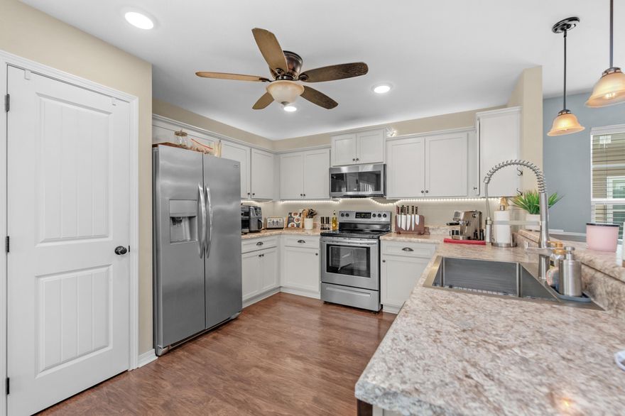 Now also for rent at $1950. Home Inspection report available upon request! Assumable VA Loan available at 4% interest rate. $5000 anyway money for the buyer. This charming home offers an open, airy layout, designed for comfortable everyday living. Downstairs, the spacious living area flows seamlessly into the kitchen, which features a breakfast bar, pantry, and direct access to the dining space. From there, step out to a perfect fenced in backyard and patio. A convenient half bath on the main level makes hosting easy.
Upstairs, you'll find three generously sized bedrooms, a full bathroom, and a large utility room. The primary suite includes a roomy walk-in closet and a private bath with a garden tub and separate shower. Outside, the home is accented with stone details, vinyl siding, decorative columns, a fully landscaped yard, and a two-car garage; adding great curb appeal to match the inviting interior.