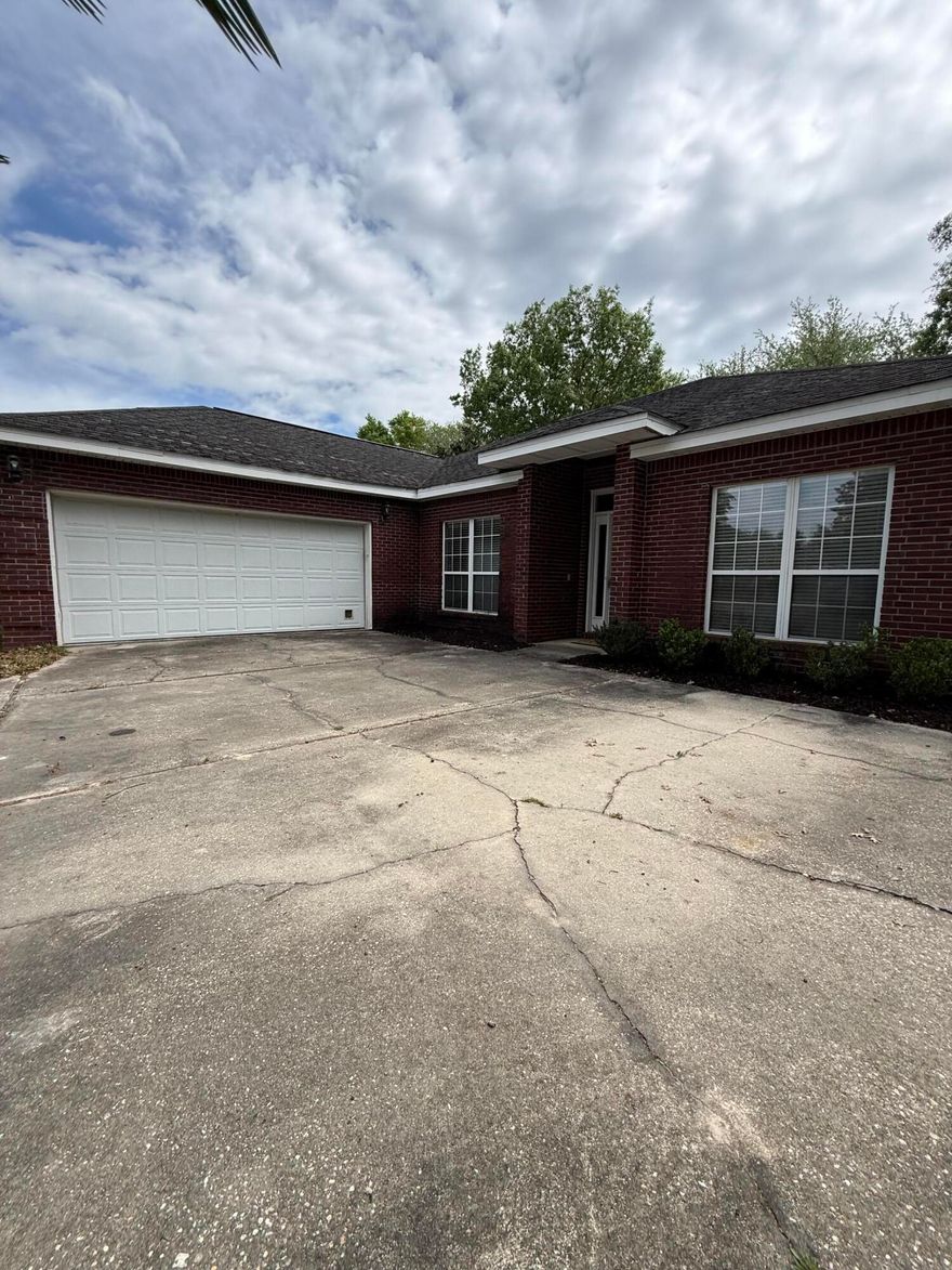 Professional photos coming soon! Welcome to Bluewater Bay living at an incredible value! This 3 bedroom, 2 bathroom home offers a highly desirable split-bedroom floor plan, spacious living area, and a layout that truly makes sense for everyday living. The kitchen is well-appointed with ample cabinetry, stainless appliances, and a functional design that flows seamlessly into the dining and living spaces. The open living area features vaulted ceilings, a cozy fireplace, and direct access to the screened-in porch - perfect for enjoying Florida evenings. The primary suite is generously sized with a large en-suite bathroom featuring double vanities, a soaking tub, separate shower, and walk-in closet. Major updates already in progress for the new owner include a brand new roof and  gas water heater, offering peace of mind and added value from day one. Outside, you'll find a fully fenced backyard with mature landscaping, plus fresh mulch and curb appeal already taken care of. The oversized 2-car garage and extended driveway provide plenty of parking and storage. Located in the highly sought-after Bluewater Bay community, this home is priced aggressively at $409,000 one of the few opportunities under $450K in the area. If you've been waiting for the right combination of location, layout, and value... This is it!