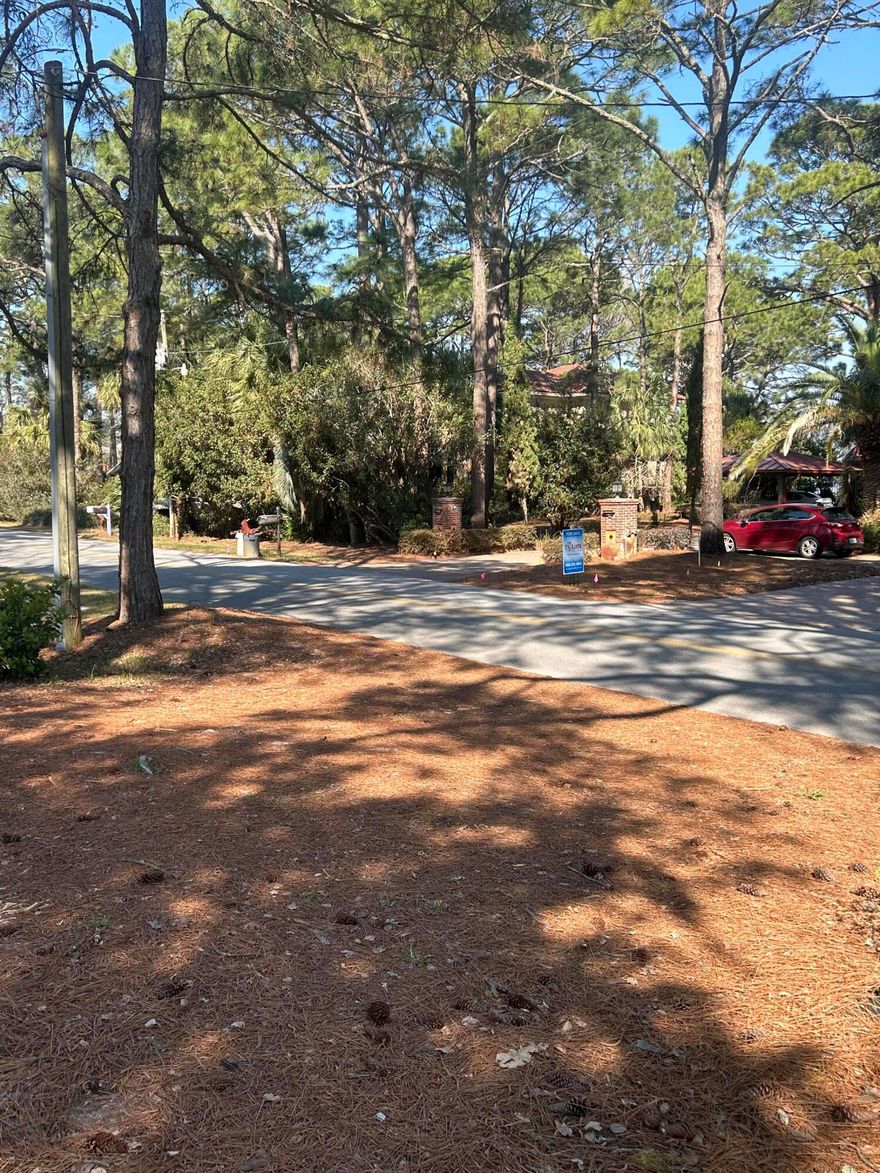 This property presents an exceptional opportunity to construct a custom residence in the tranquil setting of Miramar Beach. The parcel is prepared for development, offering direct bay views and convenient access to the beach by golf cart. The surrounding neighborhoods are well-suited for families as well as retirees seeking a peaceful environment. Each home in the area is uniquely designed, contributing to sustained property value growth. Additionally, the property is located just minutes from the newly renovated Legion Park, which features modern pickleball courts and other amenities. There is no HOA.