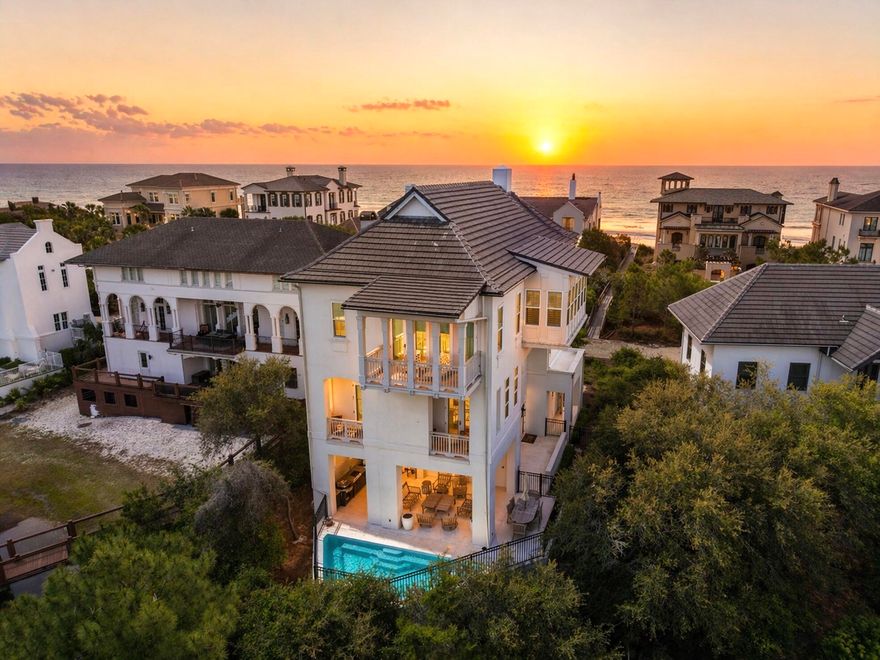 Welcome to an exceptional coastal retreat in the gated, non-rental community of Stallworth Preserve — 68 Stallworth Blvd. This masterfully designed 3-story home, built in 2021, embodies refined beach living with sweeping views of the white sand beach and emerald green waters of the Gulf. As if Gulf views weren't enough, this gem is located on a coastal dune lake as well. Step inside to discover ~3,908 sq ft of living space highlighted by 5 spacious bedrooms and 7 baths (five full, two half). On the ground level you'll find a welcoming entry, laundry area, a two-car attached garage, and an amazing outdoor living area complete with a summer kitchen and a private pool — all overlooking the serene coastal dune lake. Upstairs, four bedrooms each come with their own ensuite bath, offering