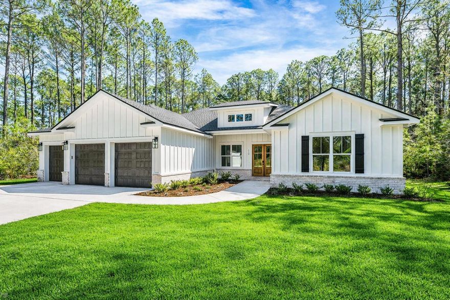 Discover modern luxury in this custom-built, new construction home tucked within the natural beauty of Steamboat Landing in Hammock Bay. Backing up to a wooded preserve and surrounded by lush landscaping, this expansive ranch-style retreat offers year-round privacy and relaxation, boasting 4,510 sqft of entertainment space with 3,363 sqft of heated/cooled living space. Blending modern convenience and timeless elegance, this 4 bedroom with a bonus room/office, 4 bath, and 3-car garage home has it all; warm champagne/bronze finishes, expert craftsmanship, detailed trim work and thoughtful design touches. Don't miss your chance to own one of the most exquisite new builds in this gated bayfront community- schedule your private tour today Featuring a gas indoor and outdoor ventless fireplace, 10ft ceilings, custom mahogany front doors, large 8x14ft glass sliding doors opening to the back patio, vast primary suite, oversize 7" cove crown molding, and a custom kitchen with a walk-in pantry, spacious island, quartz countertops, double ovens, upgraded appliances (48" wide range tope and fridge). 

Set within the master-planned community of Hammock Bay, Steamboat Landing is an exclusive enclave offering a rare waterfront lifestyle on Choctawhatchee Bay. This private, gated neighborhood features expansive homesites with luxury residences that showcase a refined coastal aesthetic and generous outdoor living spaces. Residents enjoy direct access to the bay via a scenic 500-foot pier, ideal for sunset views or launching a paddleboard. A short walk away, the new Bay Club serves as a vibrant gathering spot offering over 8,000 square feet of elevated design with wraparound porches, a cozy lounge, high-speed WiFi, and panoramic water views. Surrounded by preserved natural beauty and connected by trails, Steamboat Landing seamlessly blends serenity, luxury, and bayfront living.