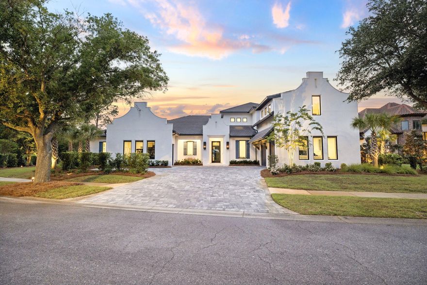Behind the gates of Burnt Pine at Sandestin, there's a home that stops you cold. You walk through the door and the 14-foot foyer opens up into the main living level, which sets the tone immediately: 12-foot ceilings, Peaky Cypress beams, a Great Room fireplace with Venetian plaster surround, and engineered white oak floors that run throughout the entire home. The chef's kitchen is anchored by a Wolf 48' dual-fuel range, Sub-Zero refrigerator and ice maker, two Bosch dishwashers, and hand-selected Calcite stone countertops -- all framed by custom maple and white oak cabinetry. A fully outfitted butler's pantry with a Fisher & Paykel refrigerator and Bosch built-in oven adds a level of entertaining capability rarely found in this market. The primary suite features all-marble tile, a Victoria & Albert freestanding soaking tub, and a custom 10-foot closet with a dedicated washer/dryer set. Two additional laundry sets are located throughout the home. The outdoor living space is equally exceptional. A screened-in gunite saltwater pool with a flush spa, three deck jets, LED lighting, and a heater is finished with travertine shell stone. Smart home integration all controlled by your phone: Lutron smart lighting, Levolor automated shades, Sonos audio throughout interior and exterior, Ubiquity whole-home WiFi and a Bosch security system. Three Rheem HVAC units and three Navien tankless water heaters ensure comfort and efficiency at scale. 

Set within the gates of Burnt Pine, this home places you inside one of Sandestin's most private enclaves where golf, marina access, private beaches, and resort amenities exist just beyond your door, yet life inside the home remains serene and personal. This is luxury defined not by excess, but by intention, comfort, and the freedom to truly enjoy where you live.