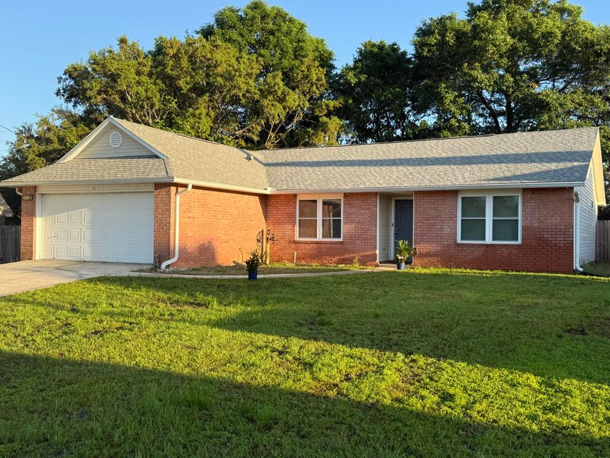 **COMING SOON** This well-maintained 3-bedroom, 2-bath brick home presents a strong opportunity for investors or owner-occupants alike in the heart of Navarre. Spanning over 1,600 square feet, it combines solid construction with strategic updates that support durability, energy efficiency, and long-term value.
Notable improvements include a 2022 roof, HVAC replaced in 2018, water heater from 2010, hurricane-rated impact glass windows and rear door reduce insurance risk, and R30 batt insulation in the attic and garage to enhance overall efficiency. The garage also features a 2024 mini-split system, creating a versatile, temperature-controlled space ideal for storage, projects, or workouts. Additional highlights include a fully fenced backyard and convenient proximity to Hurlburt Field.