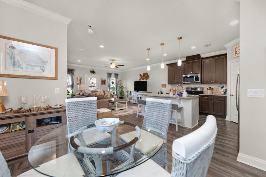 $10,000 toward buyer closing costs! Welcome to the home that checks all the boxes; then adds a few charming extras just for fun! This meticulously maintained two-story beauty offers 1,962 sq ft of thoughtfully designed living space, perfectly situated on a generous .35-acre lot. With 3 bedrooms & 2.5 baths, it's the ideal blend of comfort, style, & everyday functionality; all conveniently located near schools, shopping, & restaurants. The main level is made for living & gathering, with the kitchen, dining, & living areas flowing seamlessly together. The kitchen shines with granite countertops, a stylish backsplash, soft-close cabinets & drawers (because no one enjoys a slammed cabinet), & a center island with breakfast bar. Architectural touches like transom doorways, crown moulding, &  trey ceilings add character & charm throughout: little details that make a big impression. Upstairs, all three bedrooms & the laundry room are thoughtfully tucked away for privacy & convenience. The primary suite offers peaceful pond views, giving you a serene start & finish to each day. Step outside to your covered patio--perfect for grilling, relaxing, or simply enjoying your spacious backyard. Need extra storage? The yard building has you covered. Plus, with easy access to the HOA common area, you'll enjoy added space to stretch out & explore. Stylish, spacious, & lovingly cared for, this home is ready to make its next chapter just as special as the last.