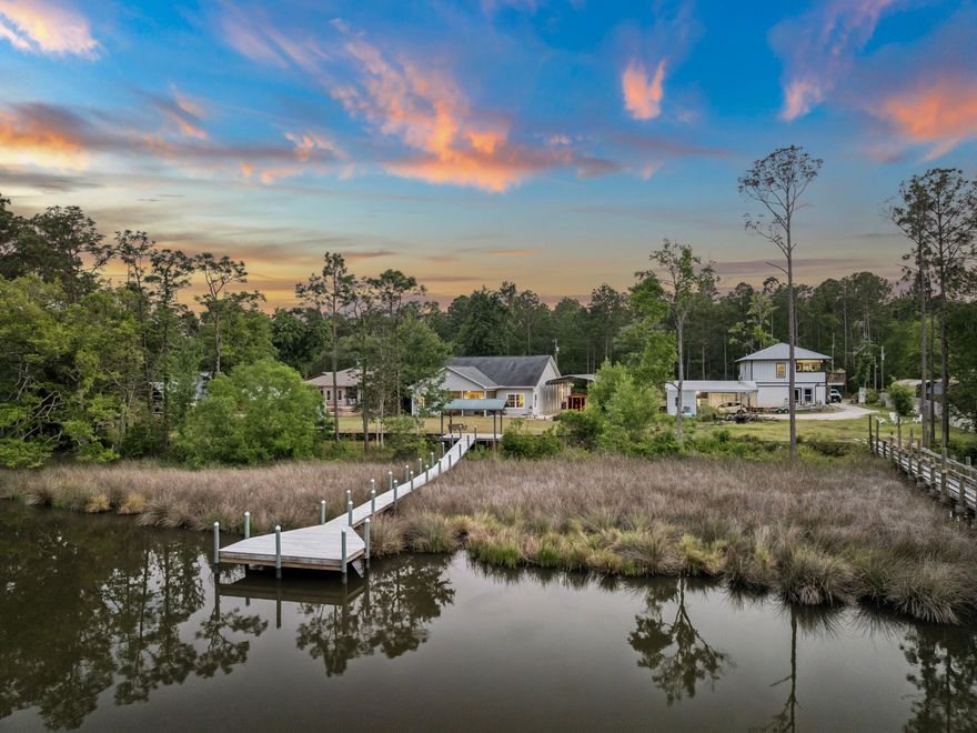 Tucked along the bayou in Freeport, just north of the 331 bridge, this single-story residence offers a quiet, relaxed approach to waterfront living just minutes from 30A.

Positioned directly on the water, the property is anchored by a private dock with covered seating and approximately five-minute access to the bay and open water. Spend mornings heading out for a quick boat ride, afternoons on the water, or evenings unwinding at the dock as the sun sets. It's a setup that makes it easy to enjoy the water regularly, whether you're boating, fishing, or simply taking in the setting. Built in 2018 and meticulously maintained, the home features a light-filled, open-concept layout that connects the kitchen, dining, and living spaces. Large windows draw in natural light and frame views of the bayou, creating a comfortable, easy flow throughout. The kitchen is both functional and well-finished, offering quartz countertops, shaker-style cabinetry, stainless steel appliances, and an oversized island suited for everyday living and casual gatherings. The layout is clean and practical. The primary suite is positioned at the rear of the home to take advantage of the water views and includes a walk-in closet with direct access to the laundry room, along with a spacious bath featuring dual vanities and a walk-in shower. A true second bedroom sits at the front, while an additional enclosed space off the main living area offers flexibility as an office, sunroom, or potential third bedroom.

Outdoor living is equally considered. A screened porch overlooks the bayou, with additional space for grilling and gathering. Beneath the oversized carport, a private sauna adds a refined layer to the home's outdoor experience. Additional features include a two-car garage, covered RV parking with power and water hookups, and a dual-fuel whole-house generator capable of running on gasoline or LP. 

Set along a quiet, single-street stretch with no HOA, the property offers a sense of calm and space while remaining close to Freeport, the 331 corridor, and the beaches of 30A.