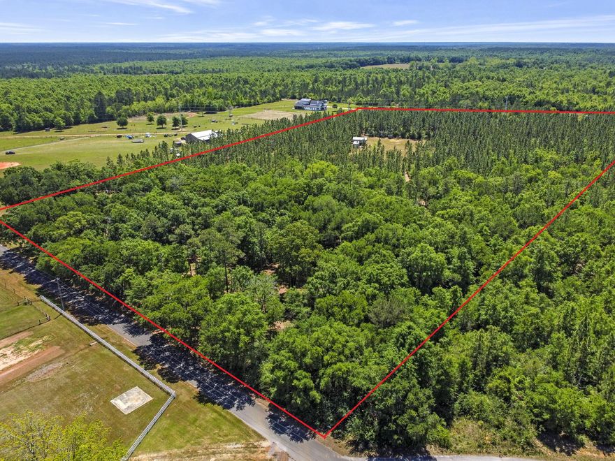 Discover the possibilities with this expansive nearly 15-acre parcel located in Pace, just minutes from Wallace Lake Elementary, grocery stores, shopping, and dining! The land features mature live oaks and pine trees throughout, creating a picturesque natural setting. Approximately 1,400 feet of fencing runs along the front of the property, complete with gated access, suitable for privacy or livestock. Two service roads provide easy navigation and portions of the land have already been cleared, including a prime spot ready for construction. The property is well-equipped with valuable improvements, including a 12x28 metal building (2021) with electricity connected and a 30x20x12 metal pole barn/carport (2023). An RV hookup and well house with potable water are already in place, and power is readily available with a pole installed on-site. With no HOA restrictions, you'll enjoy the flexibility to build and use the land to suit your vision. Set within an area of emerging, well-kept homes, this property offers both convenience and a sense of space, all tucked away on a quiet dead-end street for added privacy. This is a rare opportunity to own a sizable, partially improved lot in a growing and desirable location!