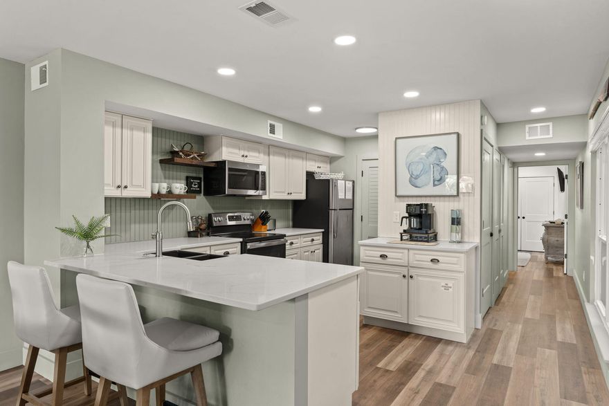 Do not miss this completely renovated, adorable  one bedroom rental machine grossing over $40K in 2025!   What's new?  Kitchen cabinetry; quartz counters,  HVAC, Luxury Vinyl Flooring throughout, paint, and lighting fixtures top the list  Bathroom has been ''gutted'' and redone.  A  built in master closet, true laundry area; pantry and owner closet were redesigned to maximize space.  Large open living area and 10 x 12 covered porch overlooking the signature Links 16th hole  provide  extra living space.   The views are amazing.  There is a large outdoor storage area for Bicycles and Beach 'stuff'. Private community pool (shared with Grand Harbour) There is nothing to do except move in, keep as a second home, or use it as a vacation rental.