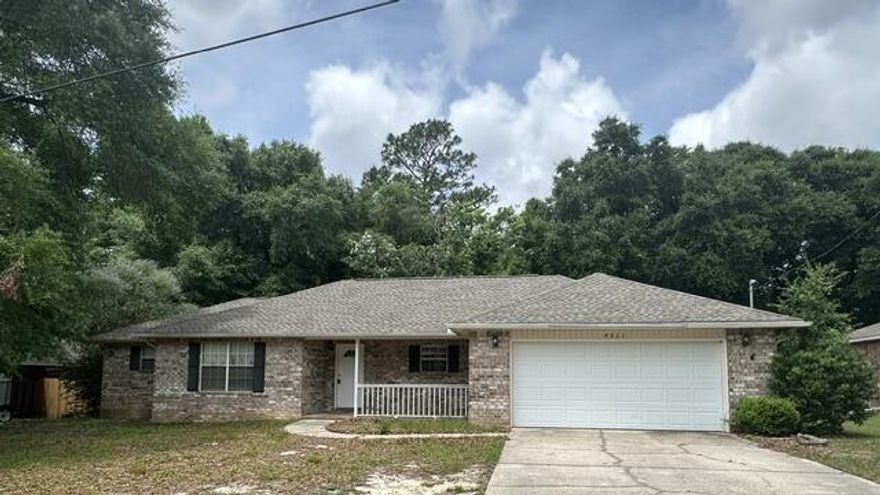 Welcome home to this beautifully maintained all-brick home located in the quiet and family-friendly Golden Oaks subdivision just outside the city limits of Crestview. This spacious 1,705 sq ft, 3-bedroom, 2-bath home offers a desirable split-bedroom floor plan and a peaceful country setting of a serene cul-de-sac while still being less than 5 minutes from I-10 and downtown Crestview.

Step inside through the oversized foyer into a massive living room featuring soaring cathedral ceilings and upgraded laminate wood flooring. The kitchen and dining areas showcase elegant tile flooring, which also extends into the bathrooms and laundry room for easy maintenance.

The thoughtfully designed split floor plan provides added privacy, with the secondary bedrooms located on the opposite side of the home from the primary suite. The spacious primary bedroom features a tray ceiling and plenty of room for a sitting area. The en-suite bathroom includes dual vanities, a relaxing garden tub, separate shower, and an oversized walk-in closet.

Enjoy cooking and entertaining in the open kitchen that flows seamlessly into the dining area. Outside, the fenced backyard offers excellent privacy with no rear neighbors, plus an arbor-covered patio and storage building for added storage and convenience. The attached two-car gar garage offers privacy, security, and a storage closet for cleaning or maintenance supplies.
Pet restrictions apply.