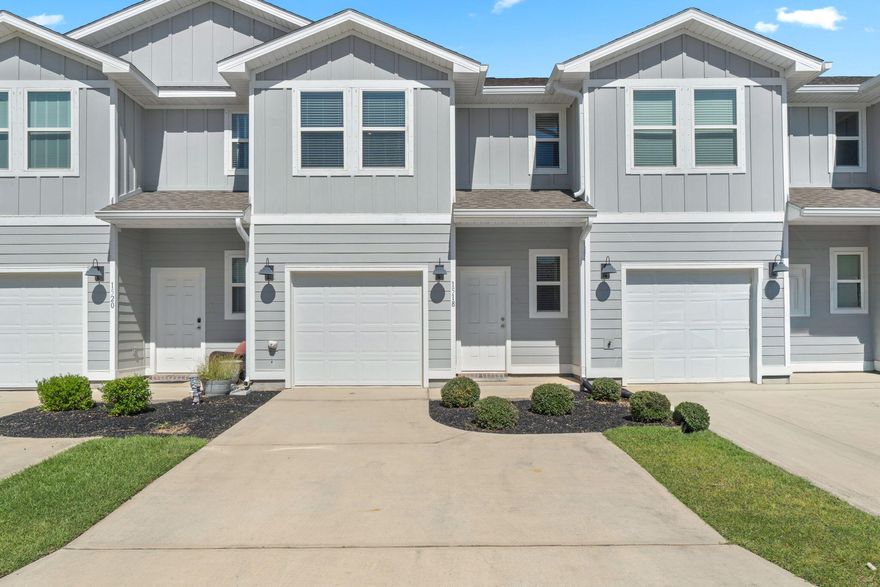 Seller offering interest rate buy down with use of preferred lender! Welcome to this like-new Pensacola townhome! Conveniently located to Publix, dining options, and the Navy Federal Credit Union campus. You'll walk into the open-concept kitchen that features granite countertops, stainless steel appliances, and overlooks the living room with access to the back patio. Downstairs also includes a half bath, hydraulic sprinkler system, and LVP flooring. Upstairs is the primary bedroom with an oversized closet and ensuite bathroom with double vanity featuring granite countertops. Two additional bedrooms, full bath, and laundry room are on the back side of the home. The community features NO rental restrictions, a community pool and clubhouse. The HOA also covers the exterior insurance, land- scaping, maintenance around the community, and a termite bond!