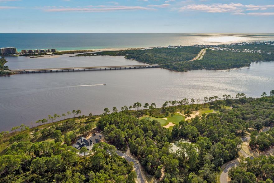 An extraordinary opportunity to design and build a custom residence in one of the Emerald Coast's most prestigious gated communities. Ideally positioned along the award-winning Greg Norman Shark's Tooth Golf Course, this expansive homesite offers just under half an acre and showcases approximately 100 feet of serene lake views, beautifully framed from its premier golf course setting. Elevated among the highest homesites along the street, the property offers enhanced privacy and sweeping, unobstructed vistas of both the water and the fairways. This exceptional homesite presents a rare canvas to create a refined coastal retreat, where thoughtfully designed architecture can fully capture the natural surroundings. Imagine expansive outdoor living spaces, elegant interiors, and panoramic views that blend the tranquility of the lake with the lush greenery of the course. Nestled within the exclusive gates of Wild Heron, residents enjoy a lifestyle defined by luxury, nature, and recreation. Anchored by the renowned award-winning Greg Norman Shark's Tooth Golf Course, the community offers an impressive collection of amenities including a resort-style pool and hot tub, state-of-the-art fitness center, and a lakeside boathouse with access to kayaks and canoes on the rare coastal dune Lake Powell. Additional highlights include tennis and pickleball courts, scenic walking and biking trails, waterfront parks, picnic areas, and a fire pit perfectly positioned for breathtaking sunset views over the lake. With plans to further enhance the community dock and expand boat slip availability, Wild Heron continues to evolve, adding to its desirability and long-term value. Characterized by its distinctive Coastal Craftsman architecture, natural preservation, and proximity to the white sand beaches of Panama City Beach, this is a rare opportunity to secure a premier homesite in a community where luxury living meets timeless coastal beauty.