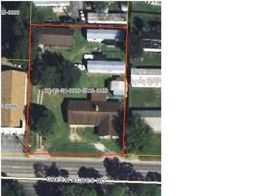 INVESTMENT DREAM WITH MAXIMUM FLEXIBILITY! Also great revelopment parcel, medical etc.Four homes on .68 acres. One 2160sf brick home (3BR, 2BA, with double carport and new HVAC system); one 896sf cedar home (2BR, 2BA, with carport); two clean 784sf mobile homes (2BR, 2BA, with 2-car parking for each, and one with new HVAC system); a 475sf fenced-in workshop/storage area that is usable by owner or rentable. All homes have w/d hookups, and serviced by a central lawn pump. Property suitable for investment, residential and/or commercial applications, zoning compliments commercial use.  Current gross income $63k annually