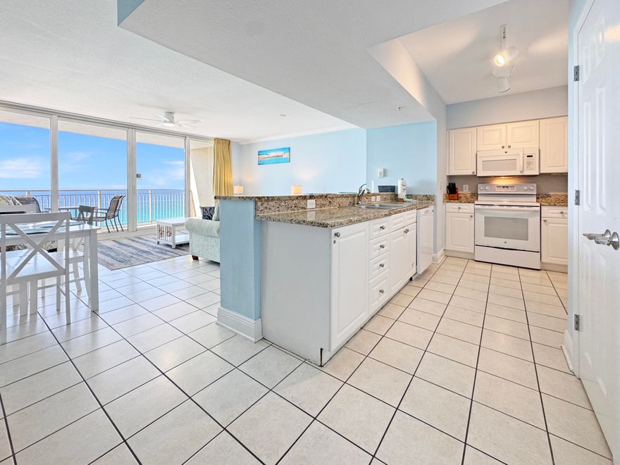 This spacious Gulf-front residence at Emerald Beach Resort offers one of the largest and most desirable 1-bedroom floor plans in Panama City Beach. Designed to maximize both comfort and views, the open living and dining area features a dramatic 12-foot wall of floor-to-ceiling glass, seamlessly connecting to a private balcony where stunning Gulf views become part of your everyday living experience. The well-appointed kitchen includes granite countertops and a convenient breakfast bar, ideal for casual dining or entertaining. This unit comfortably accommodates up to six guests with a spacious primary suite (king bed), a built-in bunk nook, and a queen sleeper sofa. Two full bathrooms provide added convenience for owners and guests alike. Thoughtfully designed for low-maintenance coastal living, the condo features tile flooring throughout the main living areas, an in-unit washer and dryer, and a functional layout that lives larger than expected. Positioned on the 11th floor, enjoy a perfect balance of elevated views and privacy, with high-speed elevator access for ease and convenience. Resort-style amenities include multiple pools (Gulf-front pool, zero-entry splash pool, and seasonally heated options), hot tubs, fitness center with day spa, Sky Bar, grilling areas, on-site dining including Starbucks, gift shop, convention center, and approximately 1,000 feet of private beach frontage. Ideally located just minutes from Pier Park, popular dining spots like Sharky's Beachfront Restaurant, and top attractions including Topgolf Panama City Beach and Pirate's Voyage Dinner & Show, this property offers outstanding potential as a primary residence, second home, or investment opportunity. Property is being sold as part of a bankruptcy proceeding and is subject to court approval. Buyer to verify all details and timelines associated with the sale.
