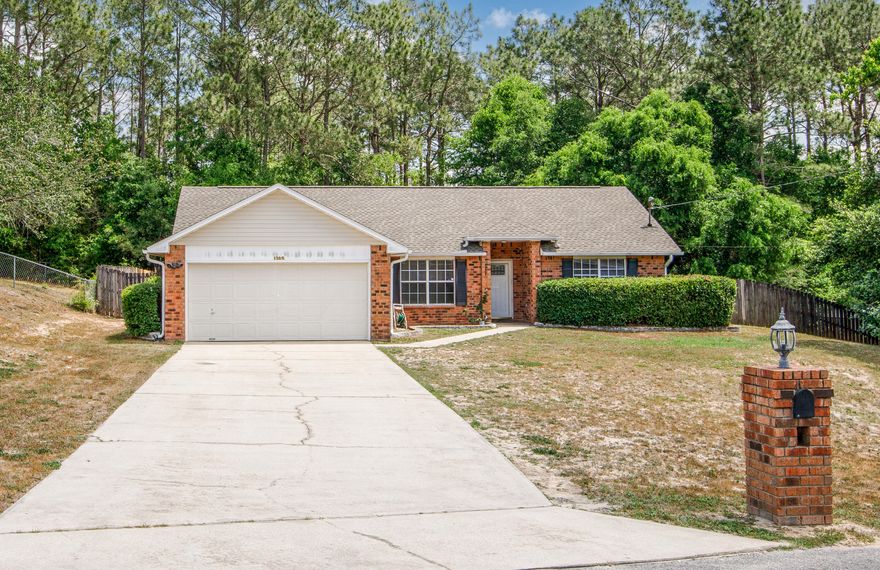 Welcome to this beautifully updated 3-bedroom, 2-bath brick home located on a quiet cut-de-sac in the sought-after south end of Crestview. Inside, you'll find fresh paint, new LVP flooring, soaring ceilings, and a well-designed split floorpan that offers both comfort and privacy. The inviting living area features a cozy wood-burning fireplace, while the spacious kitchen provides plenty of cabinet and counter space. Step outside to a screened in patio overlooking a large, fenced backyard- perfect for relaxing or enjoying your morning coffee. Roof -2022, HVAC-2020.
