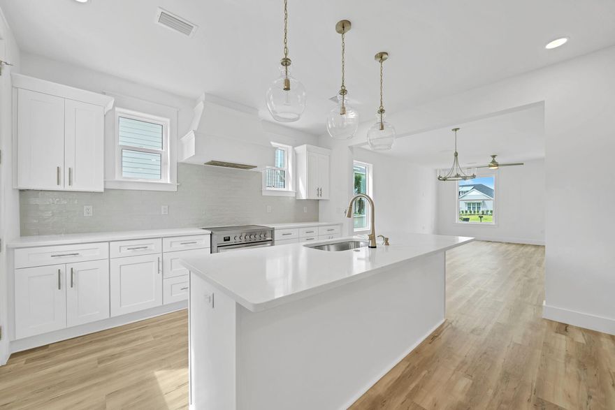 New Construction | 4 Bedrooms | Dual Primary Suites | No HOA | Near Choctawhatchee Bay.
Rare opportunity to own a custom-built, new construction home with no HOA just steps from the scenic Choctawhatchee Bay. Situated on a spacious 41-acre homesite, this thoughtfully designed property offers the ideal blend of luxury, flexibility, and coastal lifestyle. This 4-bedroom, 3.5+ bathroom home features two primary suites-one conveniently located on the main level and a second upstairs ensuite making it perfect for multi-generational living, guests, or maximizing rental potential. The open-concept living area is filled with natural light and flows seamlessly into a beautifully appointed chef's kitchen, complete with quartz countertops, white shaker cabinetry, subway tile backsplash, custom range hood, and an oversized island--ideal for entertaining. The first-floor primary suite offers a private retreat with a spa-like bath, including a freestanding tub, separate tiled shower, dual vanities, and a large walk-in closet. Upstairs, you'll find three additional bedrooms, including the second ensuite primary, plus an expansive 24x18 flex room--perfect for a media room, game room, home office, or additional living space. Enjoy peaceful mornings and sunset evenings from the upstairs balcony, where you can take in views of the bay and watch dolphins and local wildlife. Additional highlights include a large walk-in pantry, well-designed laundry room with room for utility sink, luxury vinyl plank flooring, and high-end finishes throughout. With no HOA restrictions, ample space, and close proximity to boating, beaches, dining, and shopping, this home offers unmatched freedom and lifestyle in one of Santa Rosa Beach's most desirable areas. Yes, there is room for a pool and your own personal backyard oasis. Schedule your private showing today and experience elevated coastal living without compromise.
