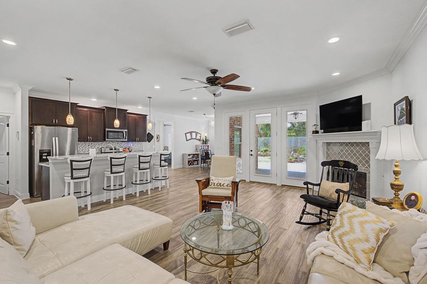 Welcome to this beautifully maintained brick home in the highly sought-after Elliott Point neighborhood--a charming golf cart community just minutes from downtown, local restaurants, concerts in the park, and the stunning nearby beaches.
This home features an inviting open floor plan designed for both everyday living and entertaining. The spacious kitchen is a true centerpiece, complete with a large center island, breakfast bar, stainless steel appliances, and a gas range. Just off the kitchen, you'll find a cozy breakfast nook, as well as an elegant formal dining area for hosting gatherings.
Offering four bedrooms, the flexible fourth bedroom is perfect as a home office, guest room, or additional living space. The expansive primary suite provides a relaxing retreat, featuring a large walk-in closet and a spa-like en suite bath with dual vanities, a soaking tub, and a separate shower designed for comfort and relaxation.

Step outside and discover what truly sets this property apart: a thoughtfully designed pollinator garden that transforms the outdoor space into a vibrant, living sanctuary. Bursting with native plants and seasonal blooms, this eco-friendly landscape attracts butterflies, bees, and hummingbirds, creating a peaceful, ever-changing backdrop you can enjoy year-round. Whether you're sipping your morning coffee on the patio or hosting friends for an evening gathering, the garden offers both beauty and purpose--supporting local wildlife while providing a low-maintenance, sustainable yard.

This home comes equipped with valuable upgrades designed for protection, efficiency, and low maintenance. Enjoy peace of mind with a whole-house surge protection system, helping safeguard your electronics and appliances. The HVAC system features UV light technology within the air vents, promoting cleaner, healthier indoor air. Outside, gutter guards are already installed, reducing maintenance and helping keep the system flowing smoothly year-round.

Located in the desirable Elliott Point community, where golf carts are a way of life, this home offers the perfect blend of charm, convenience, and connection to nature. Just minutes from downtown, waterfront parks, dining, and pristine beaches, 26 SE Okahatchee isn't just a home--it's a lifestyle.