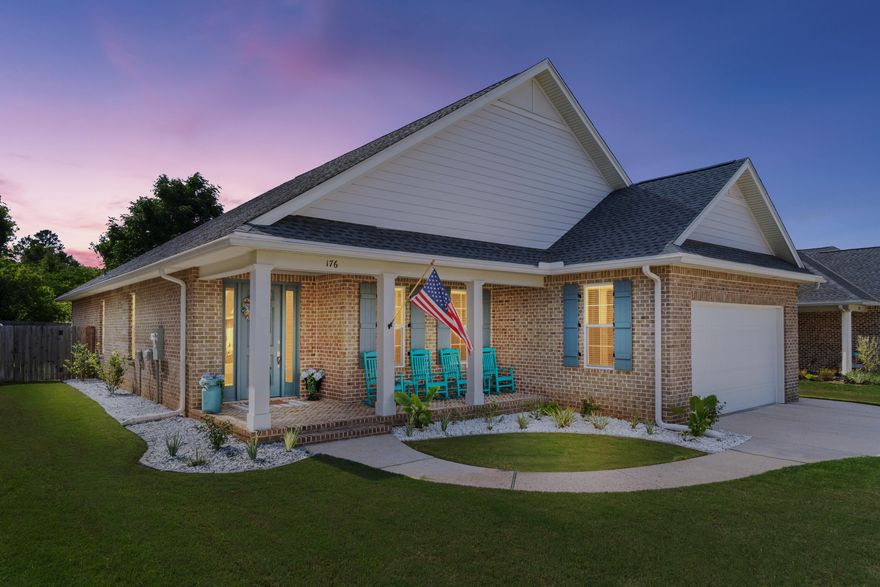 Built with comfort and thoughtful design in mind, this home offers a functional, well-executed flow. A dedicated foyer opens into 10-foot ceilings, crown molding in the main living areas, and an open-concept design that brings in natural light and a bright, welcoming feel. Eight-foot doors and continuous vinyl plank flooring create a clean, cohesive look throughout, with tile in all bathrooms and no carpet anywhere.

At the center of the home, the kitchen is designed for both daily use and entertaining. An oversized island anchors the space, complemented by quartz countertops, soft-close cabinetry, and premium Bosch stainless steel appliances. Hardwired under-cabinet lighting and a dedicated dry bar with coffee station add charm and practical detail.

A three-wing split floor plan offers separation without sacrificing connection. The primary suite is privately situated on its own side, while a second en suite is positioned on the opposite wing. Two additional bedrooms are set apart on their own. Every bedroom has a walk-in closet and ceiling fan.

Upgrades include impact-rated windows, premium black hardware, outdoor gas line for grilling, full laundry room with sink, tankless gas water heater, and exterior eave outlets for added convenience. French doors open to a screened-in porch, extending the living space outdoors. The fully fenced backyard, complete with irrigation and mature landscaping, includes double gate access on both sides of the home. An oversized front porch adds to the home's curb appeal.

Exterior construction is durable and low-maintenance, with a brick exterior complemented by Hardie board accents. The finished and painted garage floor adds a clean, polished look to the oversized two-car garage.

Located in an established residential neighborhood zoned to Niceville High School and convenient to multiple military installations and local amenities. Thoughtfully designed and worth a closer look. Video tour available upon request.