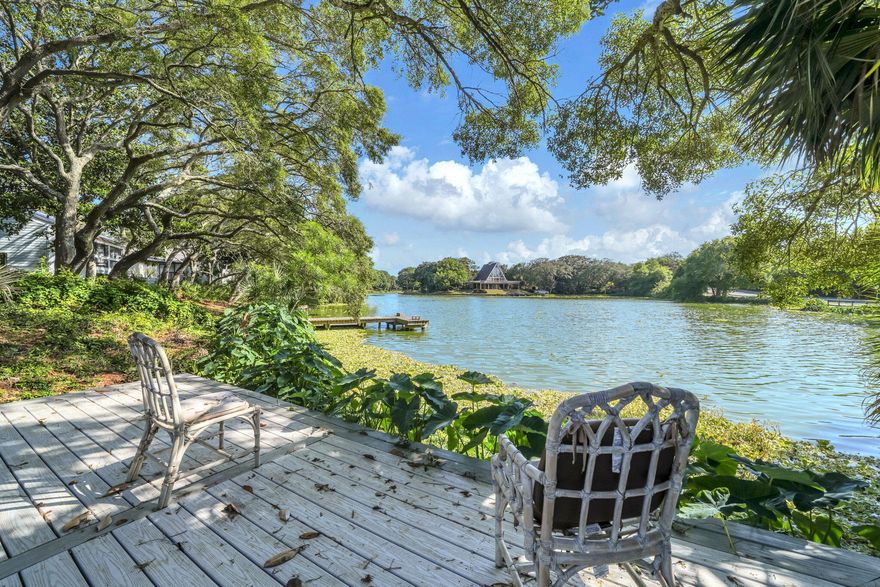 Waterfront in the heart of Destin. This spacious lakefront home features a large, lush, serene backyard overlooking the water and offers plenty of shade, 2 levels of expansive decking and pool. Inside you'll find just under 3000 square feet of living space with an oversize living room, 1st floor master, 4 beds and 3.5 baths. Upstairs you'll find 2 bedrooms and full bath. Additionally, there is a 4th bedroom with full bath located above the garage - perfect for an older teen or adult, office, craft room, and more. This home offers waterfront living at an exceptional price while also providing close proximity to all activities that Destin has to offer! Recent upgrades include new roof, paid in full solar panels, new decking in backyard, new backyard gazebo, new fence, landscaping and irrigation, resurfaced pool, smart water heater, and more!