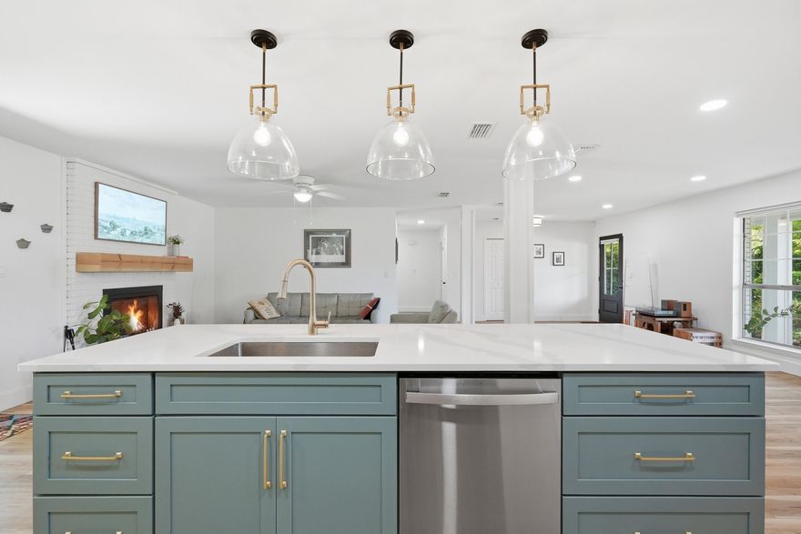 This beautiful ranch was recently remodeled in 2024 (w/ effective year built 2015)!  The sellers wish they could bring this home to their new location!  The friendly front porch and custom paver driveway welcome you as you pull up. Shutters and gutters are stylish and practical.  Step inside and you'll instantly feel at home! Stunning open-concept great room seamlessly blends the living, dining, and kitchen areas, creating a bright and inviting space perfect for both everyday living and entertaining. The expansive layout is highlighted by beautiful wide-plank flooring, abundant natural light, and a clean, modern aesthetic throughout. The kitchen features a large center island with seating, quartz countertops, stainless steel appliances, custom cabinetry, and designer pendant lighting MORE> The kitchen flows effortlessly into the spacious dining area and cozy living room, highlighted by a charming fireplace and views of the backyard.  Thoughtfully designed with both style and function in mind, this light-filled great room offers a perfect balance of warmth and sophistication, making it the true heart of the home.  The spacious and serene primary suite offers a peaceful retreat feel and even accommodates a sitting area.  Enjoy a spa-inspired ensuite with dual vanities, quartz countertops, designer lighting, and a sleek walk-in shower with tile, glass enclosure and rainfall head. The oversized walk-in closet provides ample storage and organization.  Custom cellular shades throughout the home are an upgraded bonus!  Step outside to your backyard oasis.  You'll find plenty of room for play, pets, gardening and more. A large patio creates the perfect setting for outdoor dining and entertaining, with seamless access to the home. Fully fenced, lovely landscaping, and a new lawn pump help this backyard combine comfort, functionality, and natural charm. Your TIME is valuable - and you'll appreciate being SO CLOSE to Eglin AFB, parks, Shalimar Pointe Golf, swimming, boating, fishing.....Combs Park Playground, Meigs Beach Park and Two Georges Marina.  Come enjoy the laid-back Florida lifestyle at 12 Pinehurst Drive, Shalimar FL.