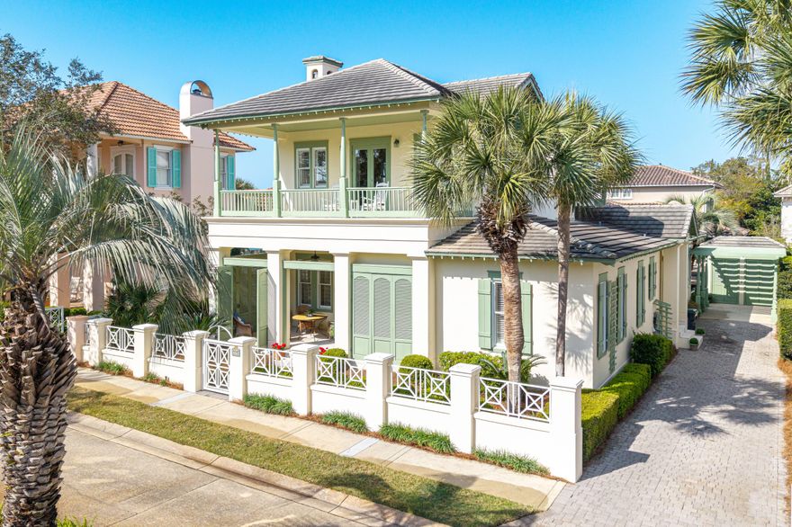 Tucked within the guard-gated, gulf-front community of Caribe and set on one of the highest elevations in Miramar Beach, this timeless coastal retreat is ideally positioned between the Gulf and the community pool--placing the best of the Emerald Coast just moments from your door.

From the moment you arrive, the home begins to tell its story. A shuttered front porch offers a private, shaded escape--perfect for relaxed dinners or slow mornings with coffee. Beyond, four additional porches unfold, each one extending the living spaces outward and inviting in Gulf breezes and soft coastal light. With five airy porches in total, the home is designed for seamless indoor-outdoor living and effortless entertaining. Inside, classic architectural details set the tone. Soaring 12-foot ceilings anchor the main living and dining areas, while solid 8-foot raised panel doors, custom millwork, and a vaulted primary suite ceiling create a refined, "Garden District" feel. The layout offers both comfort and flexibility, with two bedrooms on the main level and a private primary suite spanning the entire second floor--a true retreat above it all.

Finishes include hardwood flooring, granite countertops in the kitchen, and marble surfaces in the primary bath. Rare exterior storage is highlighted by a lattice drive-under pergola. 

Caribe is a low-density, thoughtfully planned guard-gated community known for its winding paths, lush landscaping, and rare stretch of 500 feet of private neighborhood beach--an uncrowded expanse of sugar-white sand and emerald Gulf waters that feels worlds away. With two community pools, tennis courts, and quiet beaches - there's only one Caribe. 

Originally designed by Christ & Associates, the visionaries behind Caribe, the home artfully blends a taste of New Orleans with a sense of the Caribbean--capturing a style that is both classic and enduring.

Five porches. One unforgettable sunset. And a home that lives as beautifully as it was designed.