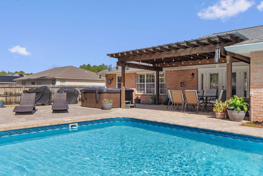 Vacation every day! Resort style backyard with a large pool, covered custom pergola, hot tub, fire pit and a huge paver patio. The perfect place to spend time with your family and friends. Gorgeous 4/2.5 home with an office that could be a 5th bedroom. The living room is very spacious and opens to the backyard. Huge kitchen, with gas stove, great for cooking and entertaining. Dining area has beautiful windows that bring in all the light. Primary suite is the perfect retreat at the back of the house. The other bedrooms are all great sizes. Plus an office/5th bedroom. Oversized lot in HBTS with large fenced area for play/pups/gardening with a shed/workshop. Enjoy the Holley By The Sea recreation center, gym, tennis courts, pool, and more. 2020 Roof & pool liner, 2021 gas water heater.