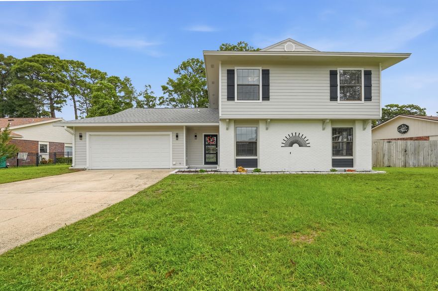 Completely renovated in 2025 and loaded with updates, this golf course home truly checks all the boxes. Major improvements include a 2025 roof, exterior composite concrete siding with fresh paint, interior LVP flooring, fresh interior paint, 2025 water heaters, 2019 HVAC, copper wiring, and an effective year built of 2020.

The kitchen has been completely redone and is packed with high-end features, including a 48-inch KitchenAid refrigerator with ice and water, built-in microwave/oven combo, and a freestanding oven with convection and air fry capabilities. Quartz countertops, custom cabinetry with built-in spice racks, an integrated all-in-one prep appliance, and a butcher block island give the space both style and functionality. This home offers plenty of room to spread out with two living areas, a formal dining room, eat-in kitchen, and an indoor wet bar. Tucked away at the back of the home, the downstairs primary suite feels like its own private retreat with a spa-like bathroom featuring an oversized shower with dual showerhead combinations, a soaking tub, and a large custom closet with functional built-ins. Upstairs, you'll find three additional bedrooms and a full bathroom.

Out back, enjoy the screened-in patio overlooking the golf course; the perfect spot to relax or entertain. Conveniently located just minutes from beaches, bases, schools, and shopping, this home offers the updates, space, and location buyers are looking for.
