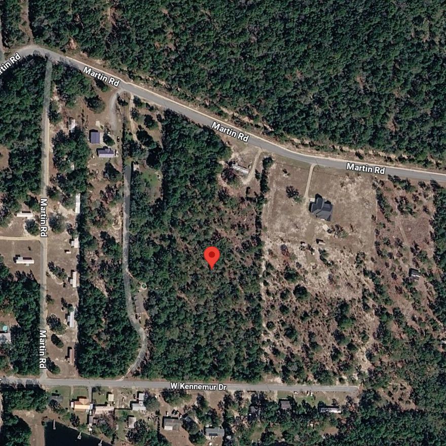 Discover the perfect retreat on approximately 7 acres of gently rolling, lightly wooded land, just a quick 5-minute drive from the heart of town! This picturesque property is not only accessible via a paved road but also surrounded by nature's beauty, featuring several charming lakes and parks nearby. Enjoy the tranquility of rural living while still being less than an hour away from stunning beaches. This is a must-see opportunity to embrace both space and convenience in a delightful setting