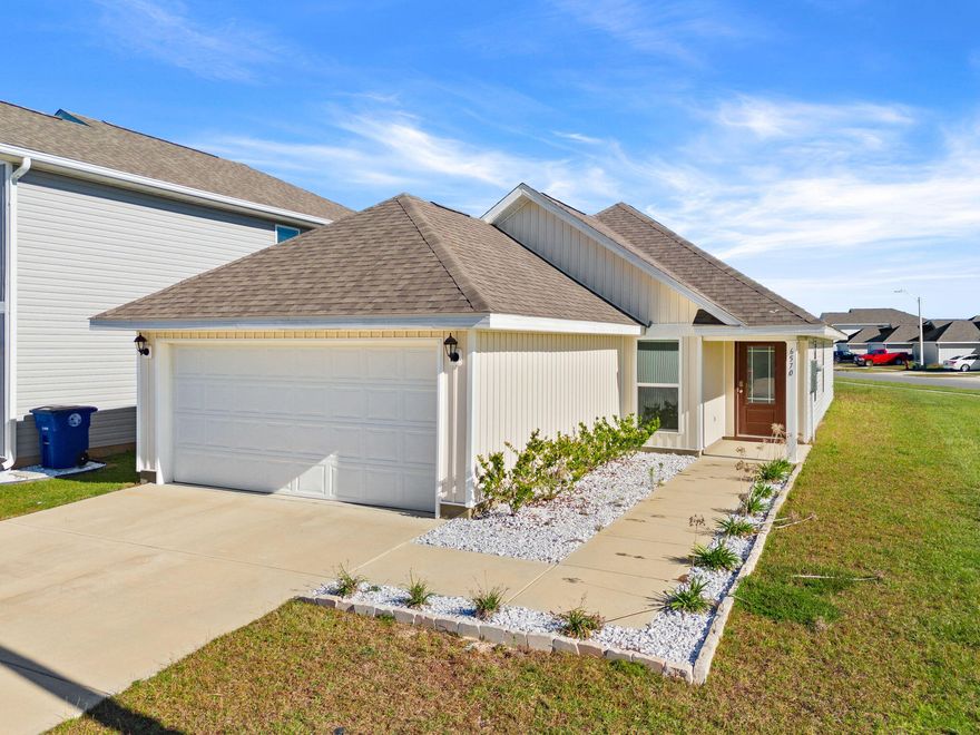 Welcome to Liberty — where comfort, convenience, and community come together! This beautiful corner-lot home is located in the highly desirable Liberty community, one of Bay County's premier neighborhoods known for its resort-style amenities and welcoming small-town atmosphere. Designed with modern living in mind, this home is move-in ready and comes with an existing 10-year structural warranty, giving you lasting confidence and peace of mind. Inside, you'll find an open-concept floor plan filled with natural light. The living room offers plenty of space for relaxing or entertaining, seamlessly flowing into the kitchen and dining areas. The kitchen features modern appliances, ample cabinetry and a peninsula style island.