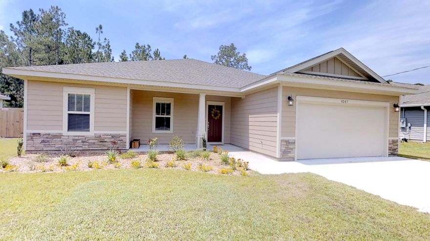 Beautiful, just-like-new, four bedroom home in prime east Navarre location, close to Navarre amenities as well as Hurlburt. This immaculate home is only one year old and has been maintained beautifully. The interior offers thick, wood laminate flooring in the common areas, neutral tile in the baths and laundry room, and carpet in the bedrooms. Crown molding and trey ceilings in the master bedroom, dining area and entry. Transom windows over the hall entries with 9 foot ceilings. Open floor plan with granite counter-tops and stainless steel appliances. Split bedrooms, all generous in size. Part of the back yard is fenced, but property line extends well beyond the fence. Room for a pool!! No HOA!