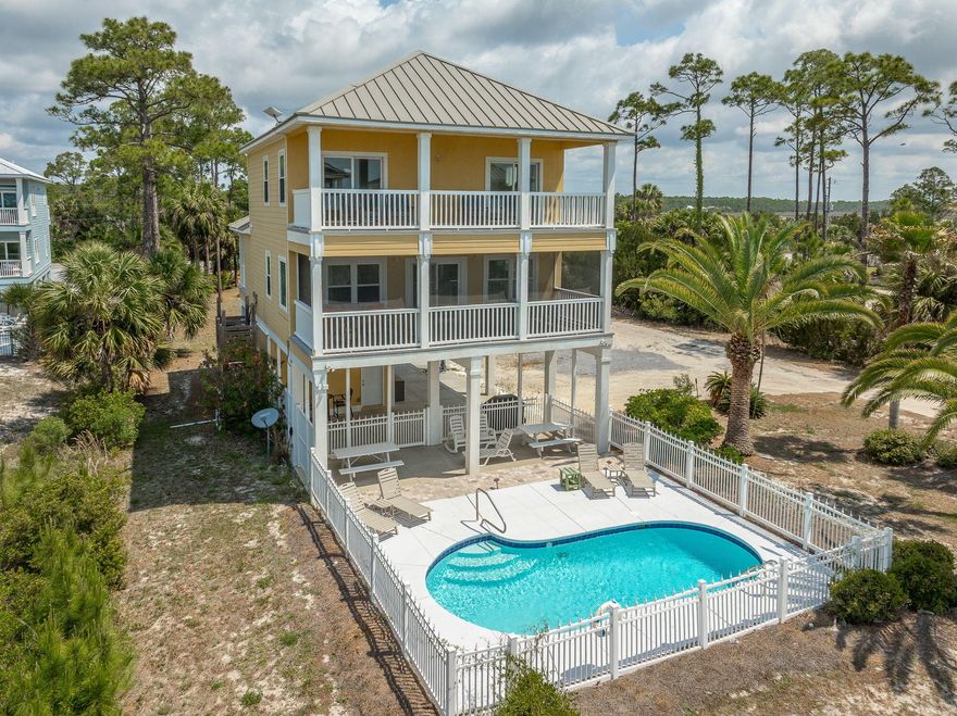 Discover the best of coastal living in Holiday House, this first-tier, move-in ready beach house. The property has been recently updated and offers direct views of the Gulf. Located in Indian Pass, a quiet area known for its natural setting, pristine and uncrowded beaches. Just a few steps to sugar-white sand beaches, this beautifully designed 4-bedroom, 3-bathroom home offers stunning Gulf views, refreshing sea breezes, and a relaxed Old Florida lifestyle. The 2nd floor features a spacious open-concept living, dining, and kitchen area filled with natural light and direct access to a full-length deck overlooking the Gulf--perfect for entertaining. This level also includes two bedrooms, including a fun and functional bunk room. The 3rd floor offers two private ensuite bedrooms, each with access to a Gulf-facing deck, creating a peaceful retreat with elevated views and added privacy. Outdoor living shines with covered porches and screened porches for year-round enjoyment, and a private pool--perfect for cooling off after a day at the beach or relaxing in the sun. A pedestrian easement to beach ensures you will always have direct access to walk to the beach. Located just half a mile from the iconic Indian Pass Raw Bar and only minutes from the shops, dining, and waterfront charm of Port St. Joe, this home offers both seclusion and convenience. Whether you're searching for a full-time residence, second home, or income-producing vacation rental, Holiday House delivers exceptional value and lifestyle.  Buyer to verify measurements.