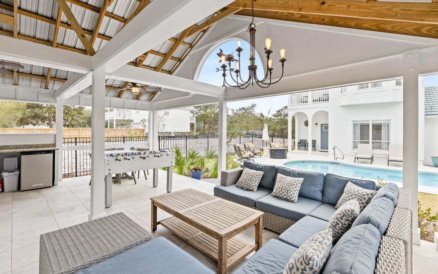 Located in a prestigious Blue Mountain Beach neighborhood with dedicated beach access, this fully furnished 4-bedroom, 3.5-bath home offers versatility for full-time living, a second home retreat, or a rental investment. The remodeled home boasts a new roof in 2025. Currently on a rental program with solid performance and upcoming bookings in place, it provides flexibility from day one. The open-concept main level connects the living, dining, and chef's kitchen featuring GE Café appliances and generous prep space. A full guest bedroom and marble-tiled bath are located downstairs for convenience. Upstairs includes a private guest suite with balcony and a spacious primary suite with marble flooring, oversized marble shower, dual patio access, and an owner's closet. A bunk room increases overall sleeping capacity. All bathrooms feature marble-tiled showers and quartz counters.

The fully fenced backyard is designed for both privacy and gathering, centered around a heated chlorine pool with a new 2026 heater, outdoor shower, firepit, and a dedicated pool house designed with entertaining in mind, complete with a half bath. The layout creates a true indoor-outdoor living experience.

Key updates include a 2025 tile roof, 5-6-year-old HVAC, 3-year tankless water heater, security system, sprinkler system, finished garage floors, and a 2025 beverage chiller. A two-car garage plus driveway and front parking provides space for 8 to 9 vehicles, a rare advantage in this area.

Whether you are seeking a primary residence near the beach, a second home with room to host, or a property with rental potential, this Blue Mountain Beach home delivers location, infrastructure, and flexibility in one complete package.


All information is deemed reliable and provided for informational purposes; buyers are encouraged to independently verify all details.