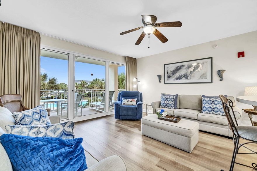 Sterling Shores- 1 bedroom second floor unit! A lovely condo with beachy decor! Perfect for a vacation get away! A fabulous resort with luxurious amenities! 400' of private deeded beach-heated beachside pool with a tiki bar & grill- views of an amazing huge lagoon style pool- first class fitness center- theater- and lush landscaping! Open floor plan which is very spacious, stainless steel appliances, unique oversized bar area  over looking the family room with lots of seating. Floor to ceiling sliding glass doors with balcony to enjoy the view of the lagoon pool. All new LVP flooring, washer/dryer, loveseat & couch, flat screen tv, plus the bedroom has a new mattress & boxsprings! Just steps to the beach, restaurants, and close to shopping! Relax & come enjoy the beach!
