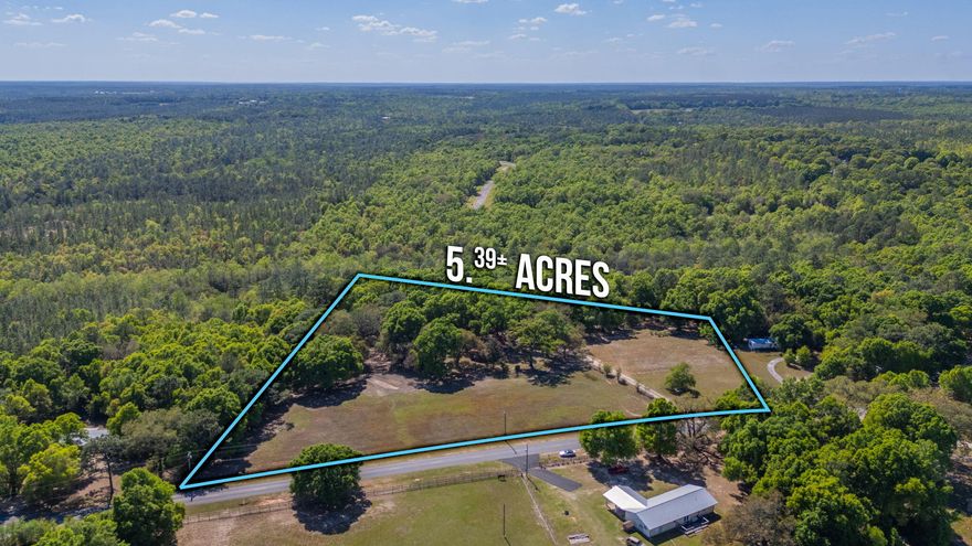 Enjoy the comforts of quiet country living w/ acreage that abounds beneath the canopy of beautiful, mature live oaks! Per county records, the property encompasses approximately 5.39 acres. A bonus is that it's located within minutes of town!! The previous owners cherished and maintained this land for nearly 45 years while utilizing it as an equestrian property for their own personal use.
The residence is a 3-bedroom, 2-bath ranch-style home offering a comfortable and spacious layout ideal for family gatherings, with both a living room and a den. The kitchen is generous in size and includes a breakfast room and adjacent formal dining area. Recent updates include an HVAC system (approximately 4 years old) and a water heater (approximately 1 year old).
Additional features include an attached  two-car carport, a covered front porch, and a covered rear deck accessible from the kitchen. The property also offers a workshop, an older horse barn, and pasture area.
Per county information, the lot may be eligible for division into three parcels. Buyer to verify and satisfy themselves regarding all information.