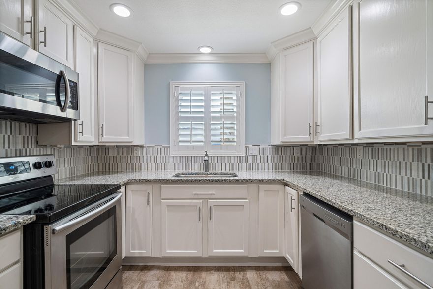 Move in ready and completely turnkey, this updated and spacious townhome offers an unbeatable location, just blocks from HarborWalk Village and minutes to the beaches. Walk or bike to some of Destin's favorite spots, including the Destin Harbor with plenty of waterfront dining and entertainment, the Destin Brewery, McGuire's, Boshamps, and East Pass Coffee - just to name a few. Enjoy the benefit of a 1 car garage, providing covered parking and room for beach gear or bikes. Inside, you'll find wood look tile flowing throughout the home. The kitchen features granite countertops, stainless steel appliances, and generous cabinet and counter space. Crown molding, recessed lighting, and plantation shutters add custom touches throughout. All bathrooms have been updated with tile and modern vanities. The oversized master bedroom features vaulted ceilings, and the master bath includes a tiled shower with a glass enclosure. A washer and dryer are conveniently located upstairs just outside the master bedroom and convey with the home. There is abundant storage throughout, with plenty of closet space, including extra storage under the stairs. Step outside in the back to enjoy the HOA maintained green space for easy, low-maintenance living. Don't miss this opportunity to own a townhome with a low HOA, in the heart of Destin...just minutes from everything the area has to offer!