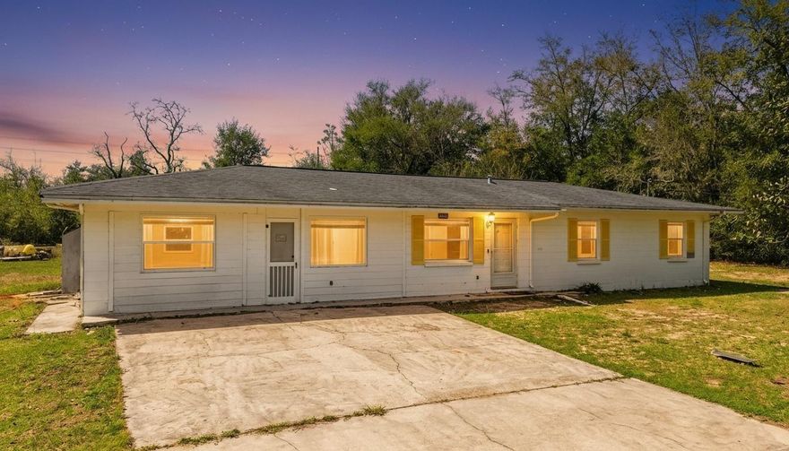 No HOA, 1 Acre of land, 4 bed 2.5 bath, block home!!! Discover the perfect blend of modern living and rural freedom in this well-maintained concrete block home, nestled on a peaceful, wooded one-acre lot in the heart of Bayou George. With no HOA restrictions, this property offers true independence, featuring a cleared area around the home ideal for parking boats or RVs, complemented by a back concrete patio and separate outbuildings for all your storage needs. The spacious 1,664+ square foot interior boasts an open-concept layout with four bedrooms, 2.5 bathrooms, and attractive hardwood-look tile flooring throughout. The chef-ready kitchen is equipped with a gas range, stainless steel appliances, and stylish barn doors, while a generous walk-in laundry room and gas tankless water heater add modern convenience. Key high-value extras include a private deep well with a Culligan water softener, a 250-gallon in-ground propane tank, and an active AC maintenance agreement with Peaden for added peace of mind. Located just a short drive from the boat ramps at Deer Point Lake and the amenities of Panama City via Highway 231, this move-in-ready gem is the ideal sanctuary for those seeking a wooded retreat with city accessibility. Schedule your showing today!