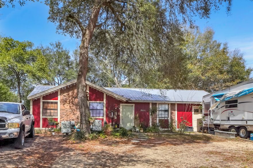 3 Bedroom 1.5 bath rental property in Milton FL.  Property includes a fire place in the living room, kitchen appliances, and a fenced in back yard.