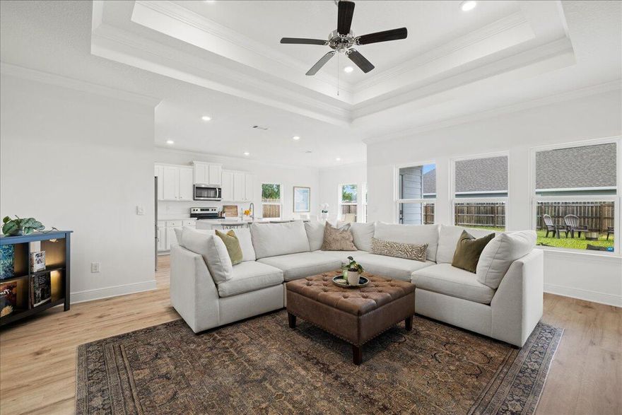 Welcome home to this must-see 2022-built single-story home, just moments away from the Gulf and vibrant 30A. This beautifully maintained 3-bedroom, 2-bathroom home blends modern and coastal elements, offering an open, light-filled layout designed for effortless living. Step inside to soaring ceilings and a seamless flow between the roomy foyer to the gourmet kitchen, elegant dining area and inviting family room - an entertainer's dream and cozy retreat all in one. The chef's kitchen is fully equipped and features a spacious island, LG refrigerator, abundant cabinetry, and pantry. Expansive windows flood the living spaces with natural light, creating an airy, comfortable ambiance.Embrace Florida living on the charming front porch overlooking a newly sodded lawn or retreat to the private, fully-fenced spacious backyard with a covered patio ideal spaces for kids, pets and al fresco gatherings. The spacious primary suite is a serene escape, boasting a tray ceiling, walk-in closet and an en-suite bathroom that has dual vanities, tiled walk-in shower, a soaking tub, and a private water closet offering a relaxing escape at the end of the day. The two additional bedrooms and well-appointed bathroom on the opposite side of the house offer flexibility for family, guests, or a home office set up. The two-car garage with additional storage shelving easily accommodates beach gear and water toys, perfect for coastal living and adventures at the neighborhood's bay access point ideal for kayaking and paddle boards. The home also comes with a home security system, Murphy bed, and a Samsung smart washer and dryer for ultimate convenience. Nestled in a quiet and friendly neighborhood, this home is just minutes from Sacred Heart hospital, 30A Public Beach Accesses, Grand Boulevard's upscale shopping and dining, and Topsail Hill Preserve State Park. Don't miss out on this incredible opportunity for a move-in-ready gem that combines style, function and a prime Santa Rosa Beach location.