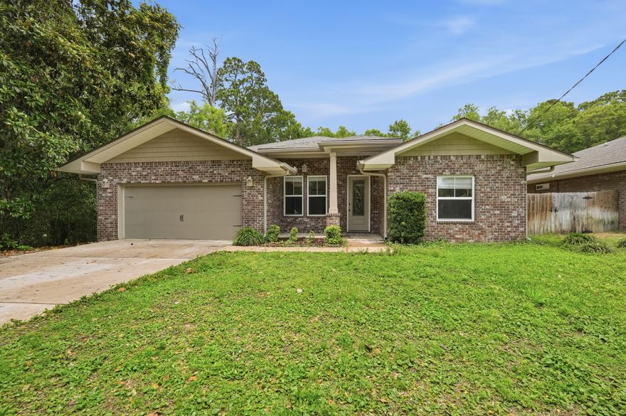 Beautifully maintained 4-bedroom, 2-bath brick home tucked away on a spacious 0.29-acre lot in the heart of Shalimar. This move-in ready home features an open-concept layout with fresh interior finishes, engineered hard wood flooring throughout the main living areas, and abundant natural light. The kitchen offers granite countertops, stainless steel appliances, custom tile backsplash, ample cabinet space, and a large breakfast bar overlooking the living and dining areas perfect for entertaining.

The spacious primary suite includes tray ceilings, dual vanities, a soaking tub, separate tiled shower, and a large walk-in closet. Additional highlights include generously sized guest bedrooms, updated lighting and fixtures, indoor laundry room, and a 2-car garage.

Enjoy a private backyard setting with mature trees while being conveniently located near Shalimar Pointe Golf Club, local parks, beaches, shopping, dining, and Fort Walton Beach. A great combination of modern updates, functional space, and desirable location!