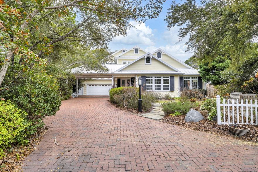 Experience coastal living at its finest in this beautifully crafted custom home, situated in an established neighborhood with private beach access and access to Camp Creek Lake.

The first floor features an open-concept design with vaulted ceilings and abundant natural light, creating a bright and inviting atmosphere. Inside, you'll find custom-built details throughout, including hardwood floors, custom cabinetry, and freshly painted interiors.

Each bedroom includes its own ensuite bathroom, offering comfort and privacy for family and guests alike.

Step outside to your private oasis - an inground pool enclosed by a two-story lanai, complete with an outdoor kitchen for entertaining or enjoying a peaceful evening.