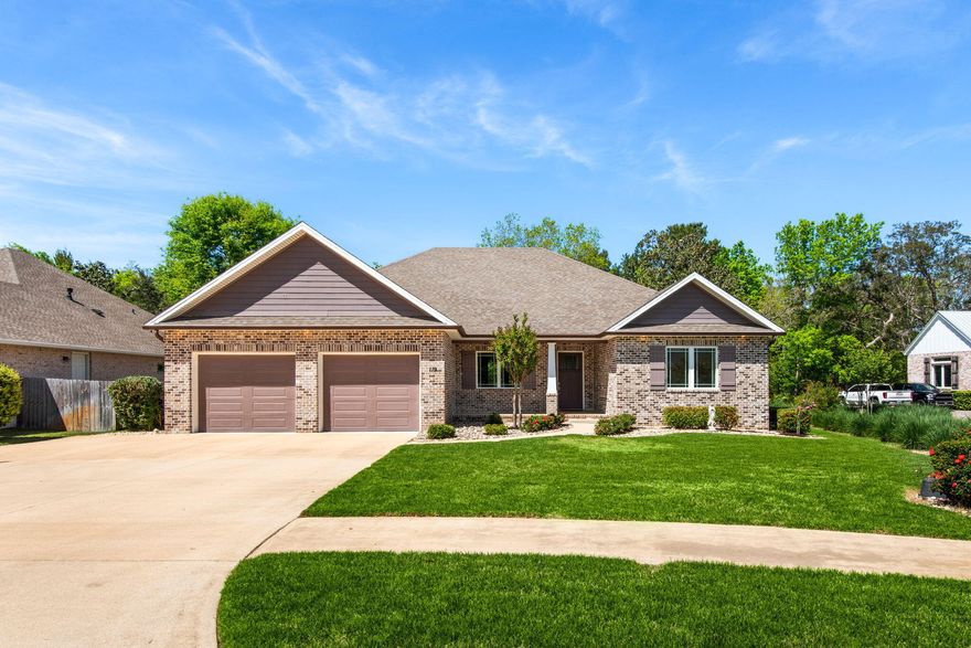 Welcome to 119 Portugal Cove--where modern elegance meets effortless living in a beautifully crafted 2018 home with 4 bedrooms, 4 full bathrooms, no HOA, and a whole-home generator for ultimate peace of mind.

From the moment you arrive to this custom built home, the classic brick exterior, manicured lawn, and spacious driveway set the tone for what's inside. Step through the front door and into a light-filled, open-concept design where wide plank flooring, soaring ceilings, and a seamless flow create the perfect space for both everyday living and entertaining.

The heart of the home is the stunning kitchen--complete with custom cabinetry, granite countertops, stainless steel appliances, a custom tile backsplash, and an oversized island with seating for a crowd. Stylish pendant --> lighting and thoughtful finishes elevate the space, while the open layout connects effortlessly to the dining area and expansive living room.

The living room is warm and inviting, centered around a beautiful stone (electric) fireplace with a custom mantle, perfect for cozy evenings or hosting guests. Large windows flood the space with natural light and offer peaceful views of the private backyard.

Retreat to the spacious primary suite, where comfort meets luxury. The ensuite bathroom features dual vanities with granite countertops, a walk-in tiled shower, and generous storage, creating a spa-like experience right at home. Each additional bedroom is well-sized and thoughtfully designed, with access to beautifully finished bathrooms throughout. The split bedroom layout provides privacy and flexibility with space, plus, each bedroom has access to its own private bathroom for ultimate comfort and lux living. 

Function meets convenience with a dedicated laundry room, additional storage spaces, and a flexible second story room, perfect for a home office, play room, or additional storage.

Step outside to your extended covered patio and enjoy a large, private backyard bordered by lush greenery--ideal for relaxing, entertaining, or even adding a future pool. The space offers both tranquility and room to make it your own. Exterior storage is connected off the back corner of the home an provides ample space for additional yard and garage items. 

Built in 2018, this home offers the benefits of newer construction along with thoughtful upgrades, including a whole-home generator, ensuring comfort and reliability year-round.

This is the one that checks every box--space, style, privacy, and peace of mind--all wrapped into one exceptional property! Come see this stunner today!