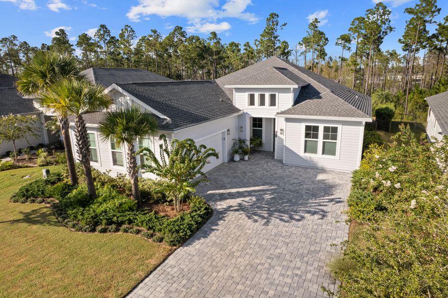 Welcome to Naturewalk at Watersound Origins, a luxury gated community along the 30A corridor offering exclusive resort-style amenities. This stunning 4BR|3.5BA Redington floorplan rests on a premium, ultra-private lot backing to a protected nature preserve delivering serene views & complete tranquility.  Thoughtfully designed for effortless single-level living, the open concept layout seamlessly blends indoor/outdoor spaces.  With over $250k in curated upgrades & offered FULLY FURNISHED, every detail has been selected for elegance and comfort.  

Inside you'll find 10ft ceilings, 8ft doors, custom woodwork, Levolor top-down/bottom-up cellular shades & designer lighting which create a warm refined atmosphere.  Living Rm features beautiful wood beamed ceiling, built-in cabinetry, 5-panel folding glass doors that open to the Lanai complete with motorized, retractable screens-creating seamless indoor-outdoor living year round! You will fall in love with this dream Kitchen fully equipped with stacked cabinetry that stretch to the ceiling and custom layout upgraded with deep pot drawers, stainless steel appliance package with GE Café 5 burner gas cooktop & wine fridge, premium quartz island with waterfall edge wrapped in shiplap, under cabinet lighting & water filtration system. 

Primary Suite is a true sanctuary tucked away at the rear of the home flooded with natural light & offering direct lanai access.  Spa-inspired bath boasts a soaking tub, walk-in shower, dual vanity & a showstopping custom closet designed with organization and style in mind!  Guest suites are equally refined, each with en-suite baths enhanced with wainscoting & elegant finishes.  Additional highlights include a spacious laundry room with tons of cabinetry, sink & custom coat closet - W/D stay, 2 car garage with EV charger outlet & additional refrigerator along with garage ceiling storage racks.
Step outside to experience the crown jewel of this home - a backyard oasis featuring a 14 x 26ft saltwater pool w/an 8 x 8ft tanning ledge, sheer descent waterfall, glass bead gunite finish and lush professional landscaping & lighting along w/sprinkler system - overlooking the nature preserve.  Whether hosting summer barbecues or enjoying quiet evenings under the stars, this outdoor retreat is the ultimate extension of your living space.

As part of Naturewalk at Watersound Origins, residents enjoy access to all Origins premier amenities including resort-style pools, hot tub, firepit, fitness centers, pickleball & tennis courts, walking trails, unlimited golf, playgrounds, access to Lake Powell w/complimentary kayaks for residents-all within this non-short-term rental community.  Additionally, at the neighborhood entrance, Watersound Town Center is growing and includes Publix, multiple restaurants, coffee shops and much more.  30Avenue, Rosemary and Alys Beach are just a short bike ride away!  Enjoy everything the sugar white sands of the Emerald Coast has to offer!