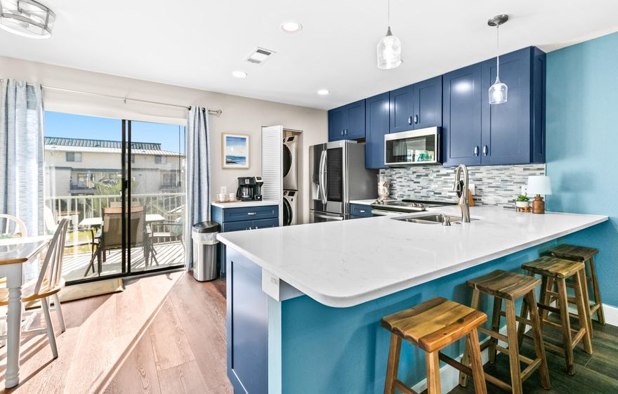 Charming, updated 2-bedroom condo in the heart of Miramar Beach, located in the low-density Sandprints community just blocks from the sugar-white sands and emerald waters of the Gulf. Enjoy Gulf views from the entry and the private balcony off the primary suite. Offered turn-key and beautifully updated, this condo features new laminate flooring throughout, Quartz countertops in the kitchen and bathrooms, stainless steel appliances, updated lighting, coastal-inspired tile backsplash, new cabinetry, and a stylish coffee bar.

The spacious primary suite offers a king bed, ensuite bath, and direct balcony access--perfect for enjoying morning coffee with Gulf views. A guest bedroom, full guest bath, and full-size washer and dryer are conveniently located on the upper level. The open-concept layout is ideal for entertaining, featuring a dining area, breakfast bar, and additional dining nook near the main-level balcony overlooking the green space.

Sandprints offers a community pool & sundeck for relaxing after a day at the beach. Conveniently located near public beach access, Pompano Joe's, snorkeling reefs, and popular nearby destinations including Camille's at Crystal Beach, Silver Sands Premium Outlets & Destin Commons. Enjoy easy access to the pedestrian and bike path along Scenic 98, perfect for embracing an active coastal lifestyle. An exceptional value for the area with strong potential as a vacation rental, investment property, or second home - don't miss this opportunity!