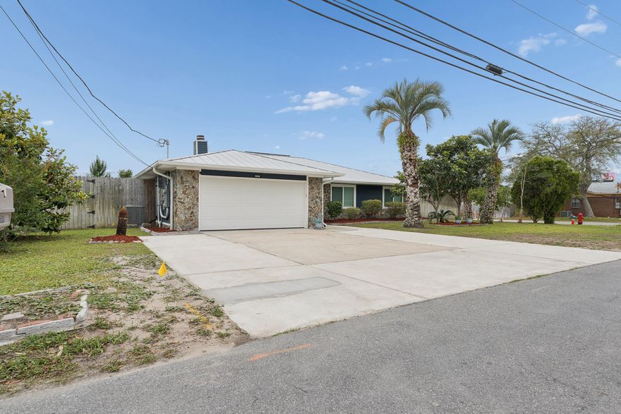 This beautifully updated like-new home in Callaway offers modern comfort, thoughtful upgrades, and convenient access to everything the area has to offer. Located just minutes from shopping, restaurants, and waterfront recreation, enjoy being approximately 0.4 miles from fishing charters at Pier 98, 1.4 miles to a public boat ramp, 4 miles to Tyndall Air Force Base, and about 33 miles to St. Andrews State Park. Extensively remodeled following the hurricane, this home features updated electrical, plumbing, and gas lines for added peace of mind. Designed with efficiency and comfort in mind, upgrades include a tankless gas water heater, whole-house generator, solar panels, impact-resistant windows, and automatic shades. The kitchen is a standout with stainless steel appliances, gas range, quartz countertops, decorative glass backsplash, and an oversized island with ample space for entertaining, gathering, or game nights. Interior finishes include recessed lighting, updated fixtures, and luxury vinyl plank flooring throughout. The spacious primary suite features dual closets and a spa-inspired bath complete with an open walk-in shower, jetted soaking tub, Bluetooth speaker, and smart lighting features. The guest bath has also been tastefully updated with a glass tub enclosure, quartz countertop, and decorative sink. Exterior improvements include durable Hardie board siding and a standing seam metal roof with all roof boots resealed in 2025. Step outside to enjoy the covered patio and fully privacy-fenced backyard. A 12x20 site-built shed with insulation, electricity, and its own covered patio provides excellent flexibility for hobbies, storage, or workspace. The backyard is enhanced with fruit trees, a fire pit area, and an additional exterior outlet ready for future outdoor additions such as a hot tub. Don't miss your opportunity to own this extensively upgraded home with modern conveniences and room to enjoy both indoors and out. Buyer to independently verify all information, measurements, dimensions, restrictions, and any matters deemed important.