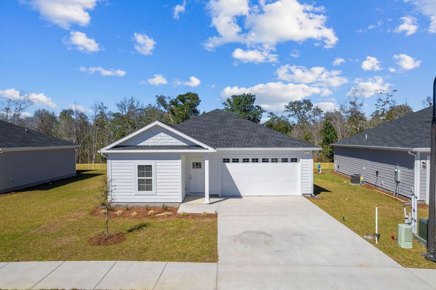 $10,000 closing cost credit with preferred lender & title + fridge and blinds INCLUDED! FREE additional upgrade on contracts executed before 3/31! A stunning new construction home in the highly desirable Riverwalk community. Construction is COMPLETE on this custom coastal-inspired residence offers a spacious two-car garage, 1850 square feet of living space, and an open floor plan for seamless living. The kitchen features quartz countertops, white shaker cabinets, luxury vinyl plank flooring, and stainless steel appliances. With superior workmanship and an upgraded trim package, this home exudes quality and style. The exterior features fiber cement HardiePlank siding, a covered patio, and the option for a screened porch and fenced-in backyard.