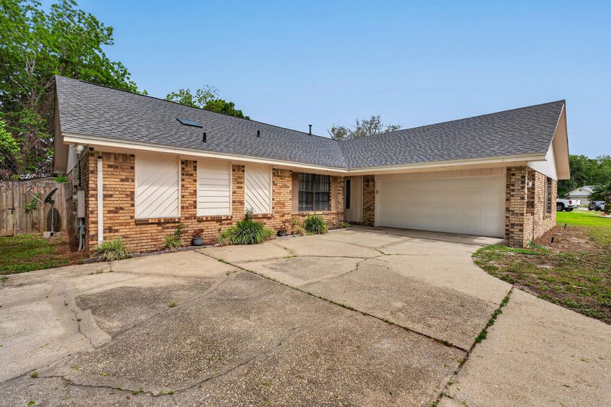 Spacious 3-bedroom, 2-bath home with over 2,000 sq ft in a highly sought Navarre neighborhood just minutes from the beach and Eglin AFB. Conveniently located within walking distance to newer Publix Plaza. Inside, you'll find vaulted ceilings, updated LVP flooring in the bedrooms, and a functional, light-filled layout. The sunroom offers versatile additional living space ideal for relaxing or entertaining. Situated on an oversized lot with plenty of room to enjoy outdoor living. Move-in ready with potential to customize and add value. A HUGE WIN! Did I mention paid off solar panels on a 2023 installed roof, newer hvac & water heater.. keeping insurance & utilites low. Come make this house YOUR home!