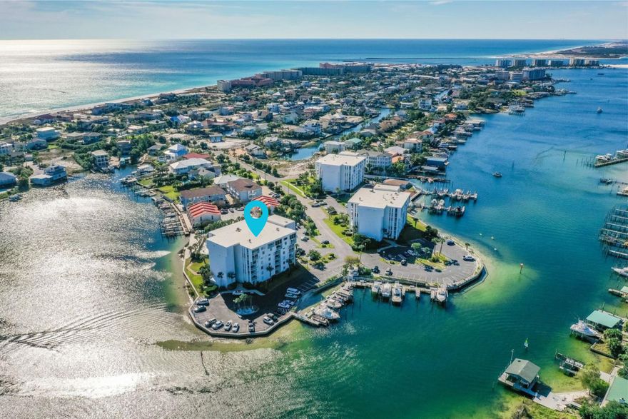 Experience the Best of Boating & Beachside living at Dolphin Point Condo, where harbor waterfront serenity meets exclusive beach access. Located within a recently improved, now a GATED community with a new pool house, refreshed pool, and updated landscaping, this property offers added privacy and appeal. Just minutes from the private deeded beach and overlooking the picturesque harbor, this meticulously updated and fully furnished 2-bedroom, 2-bath condo is truly a hidden gem.

Dolphin Point is one of Destin's best kept secrets on Holiday Isle, tucked away from the traffic yet only a short water taxi ride to HarborWalk Village. Amenities include private beach access, heated pool, clubhouse, marina with boat slips (purchase or lease), tennis and pickleball courts, kayak and paddle board launch, grilling areas, golf cart parking, storage, onsite management, and 24-hour security. A turnkey opportunity ideal for a second home, primary residence, or investment property.